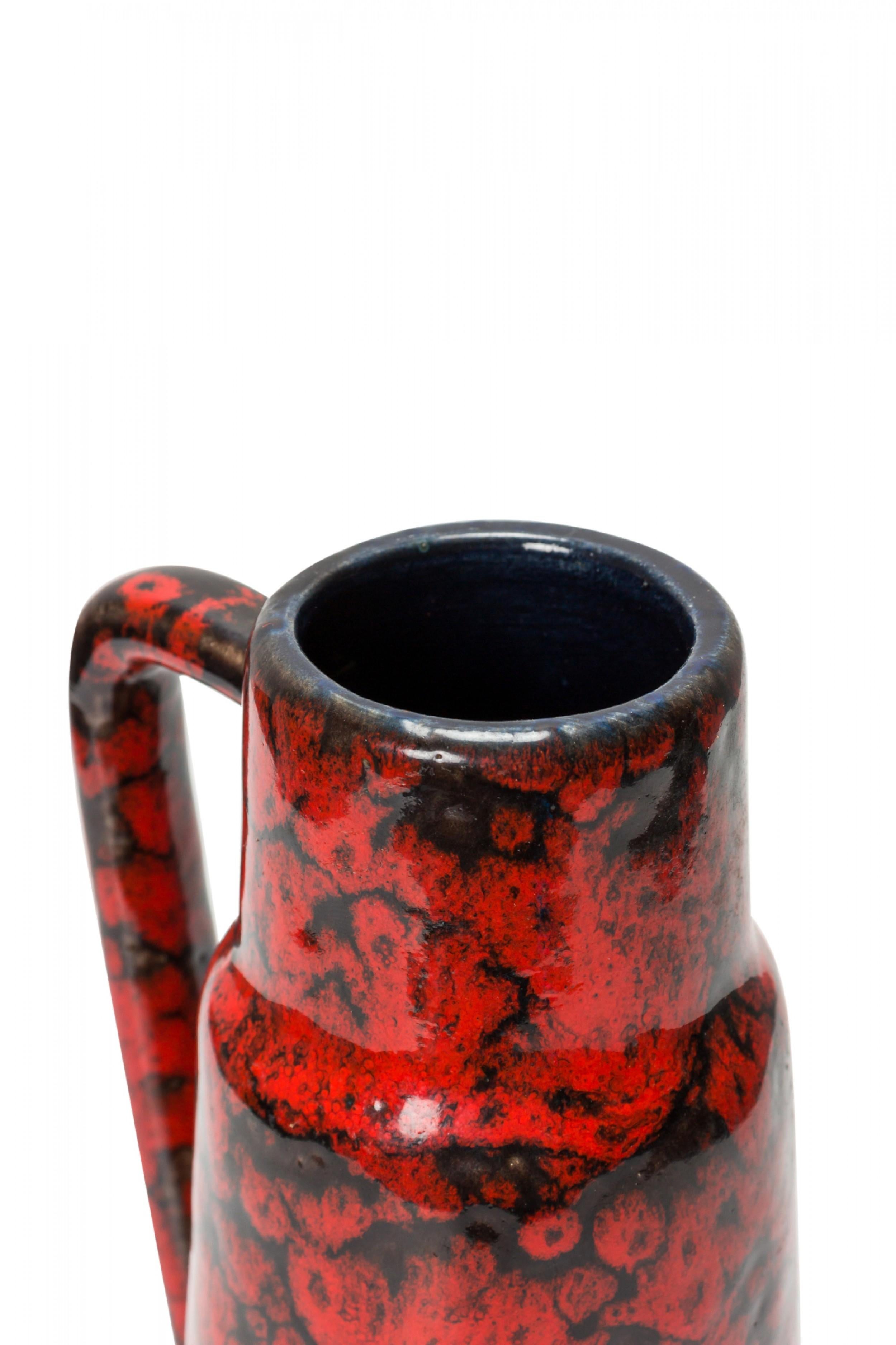 West German Mid-Century ceramic pitcher with a fat lava-style red and black glaze. (SCHEURICH KERAMIK, mark on bottom, W. GERMANY 275-20).