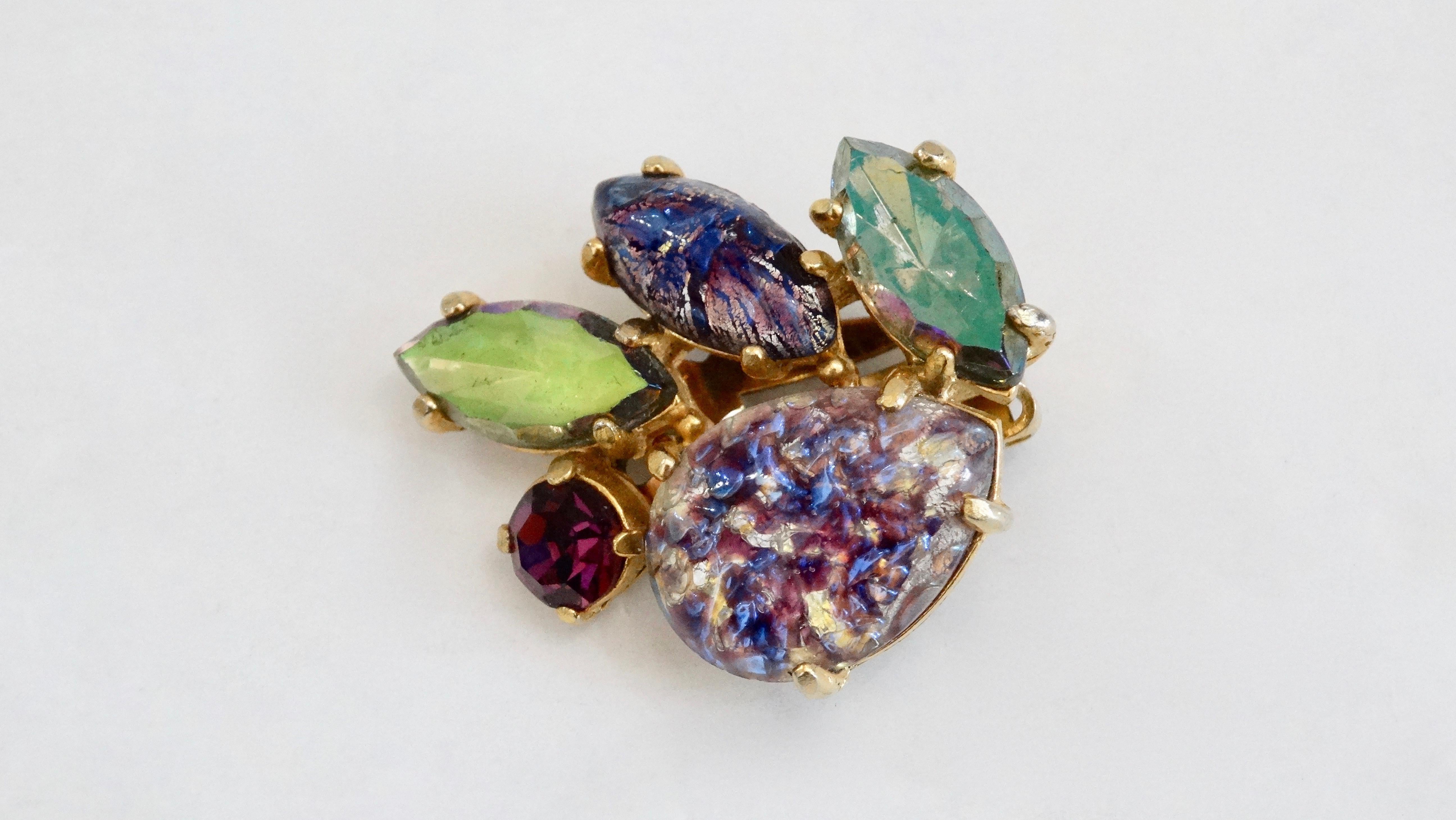 Gorgeous and timeless, these Schiaparelli earrings are perfect! Circa late 1950s, these earrings feature an assortment of multi colored crystals and various shapes and sizes. Includes clip-on closures and gold plated hardware. Pair with any evening