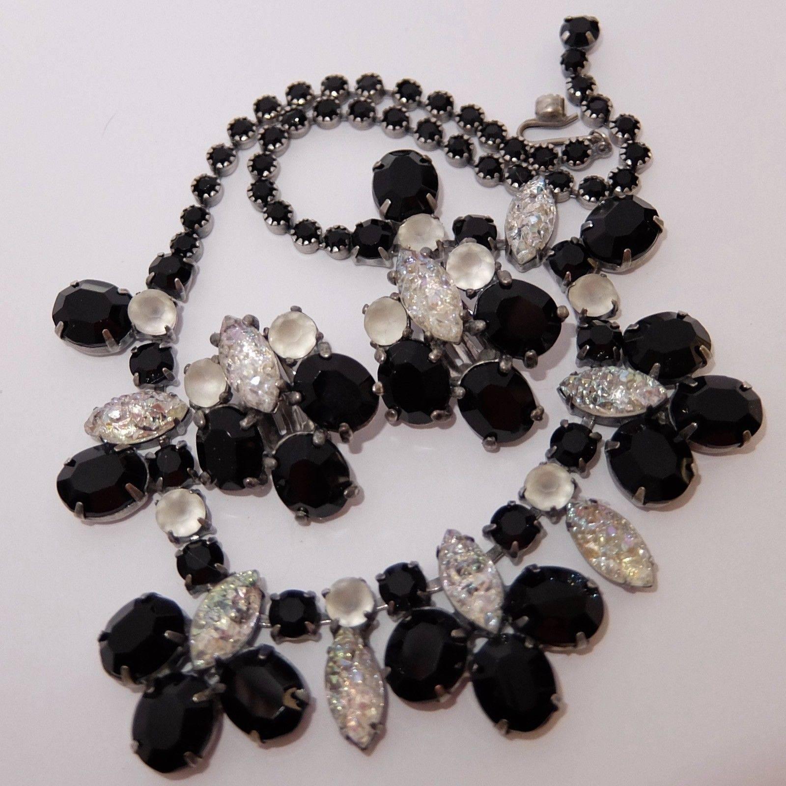 Beautiful signed Schiaparelli Runway Necklace featuring Black Crystal Faux Diamond enhanced with iridescent Lava Rock Art Glass stones; Silver Tone; circa 1950s-1960s; approx. size: 16.5” Long x 1” wide. Classic and Chic…illuminating your look with