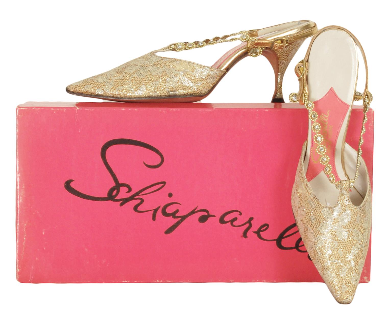 Owned by a French expatriate and shoe-hoarder, these incomparable slingbacks were adored but have remained unworn in their original box for sixty years. Featuring a modest, wearable heel, their gold and silver ground is overlain with lace netting to