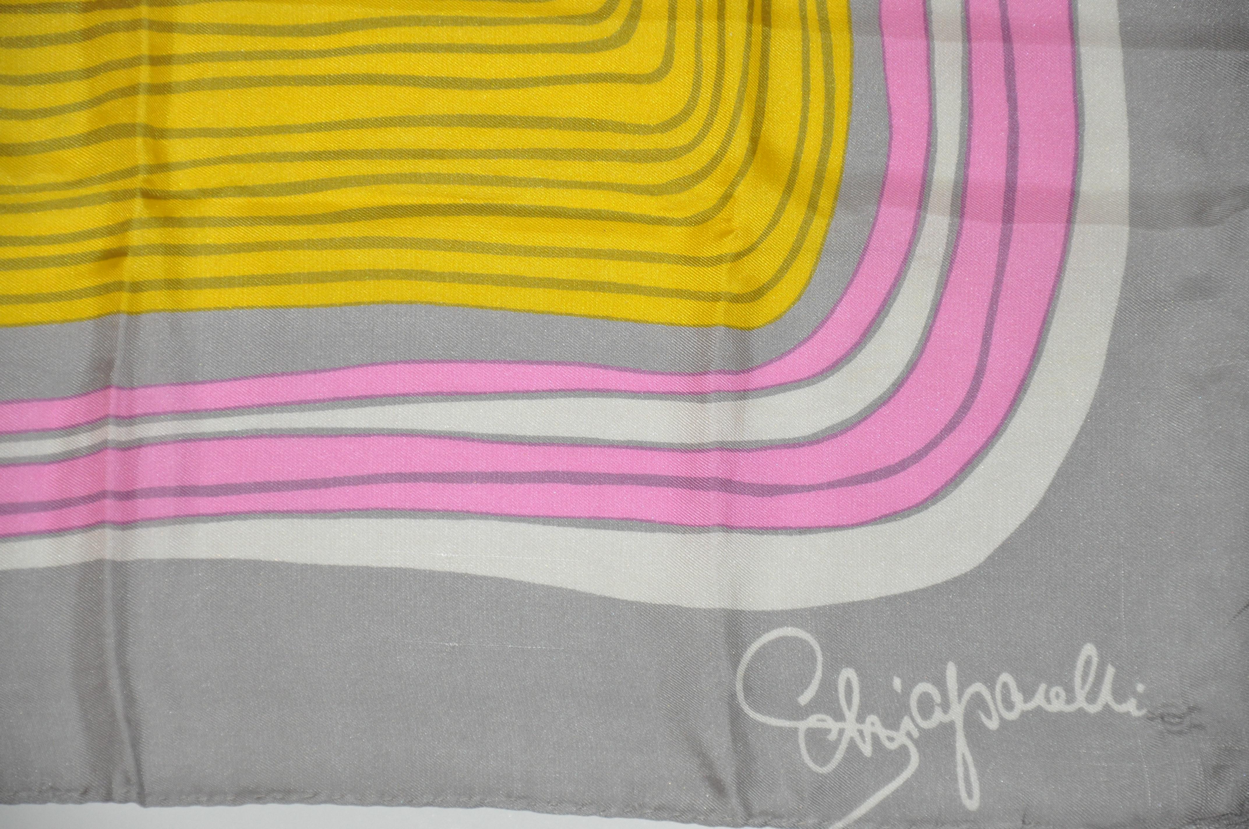      Schiaparelli's shades of pinks, yellows and ivory surrounded with steel-gray silk scarf measures 21 inches by 22 inches. Hand-rolled edges and made in Italy.
