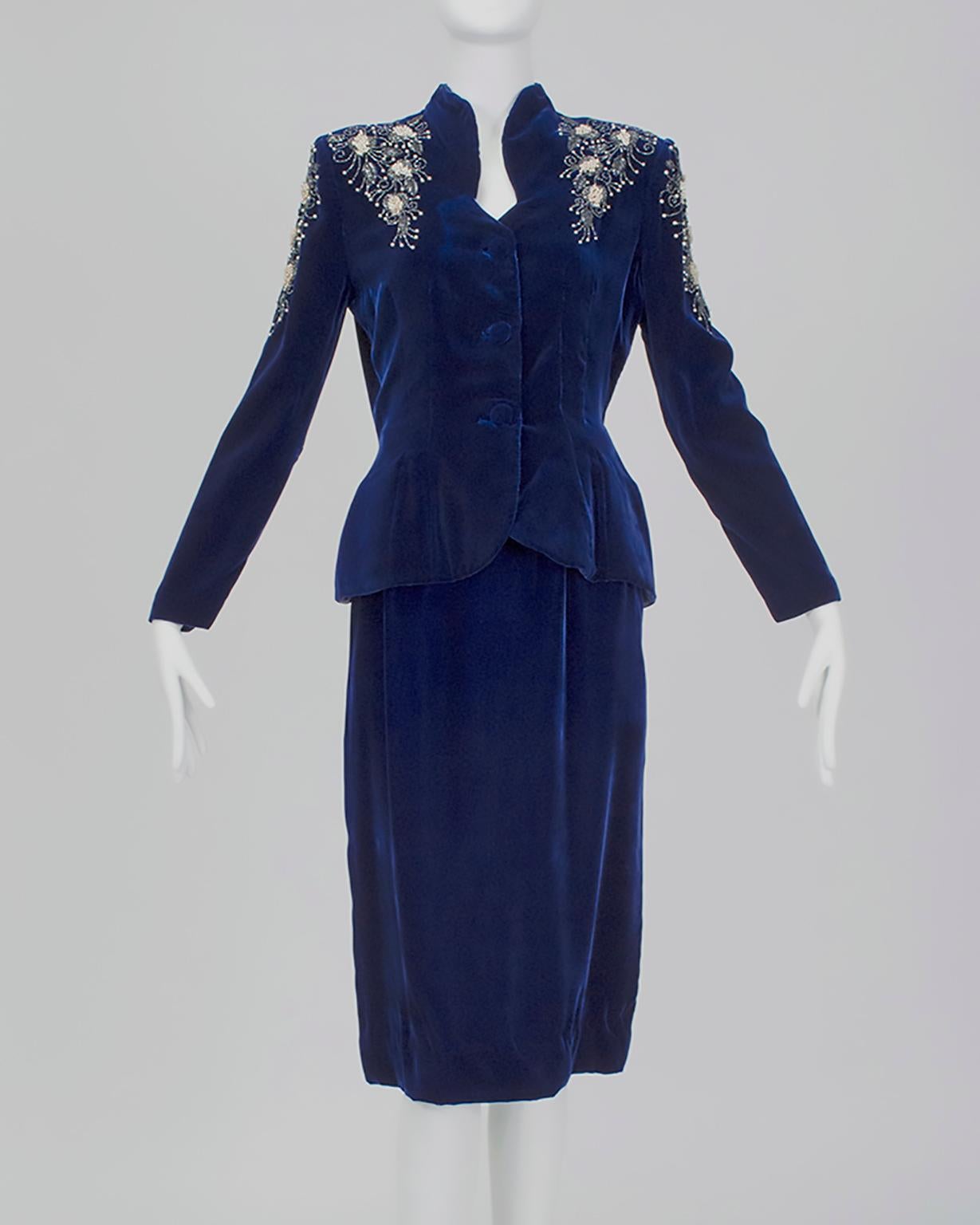 Although it bears no label, this suit betrays all the hallmarks of a Schiaparelli master work: saturated color, silk velvet fabric (her favorite), sharp shoulders paired with curving lapels, and most importantly, artisanal beading. Clearly inspired