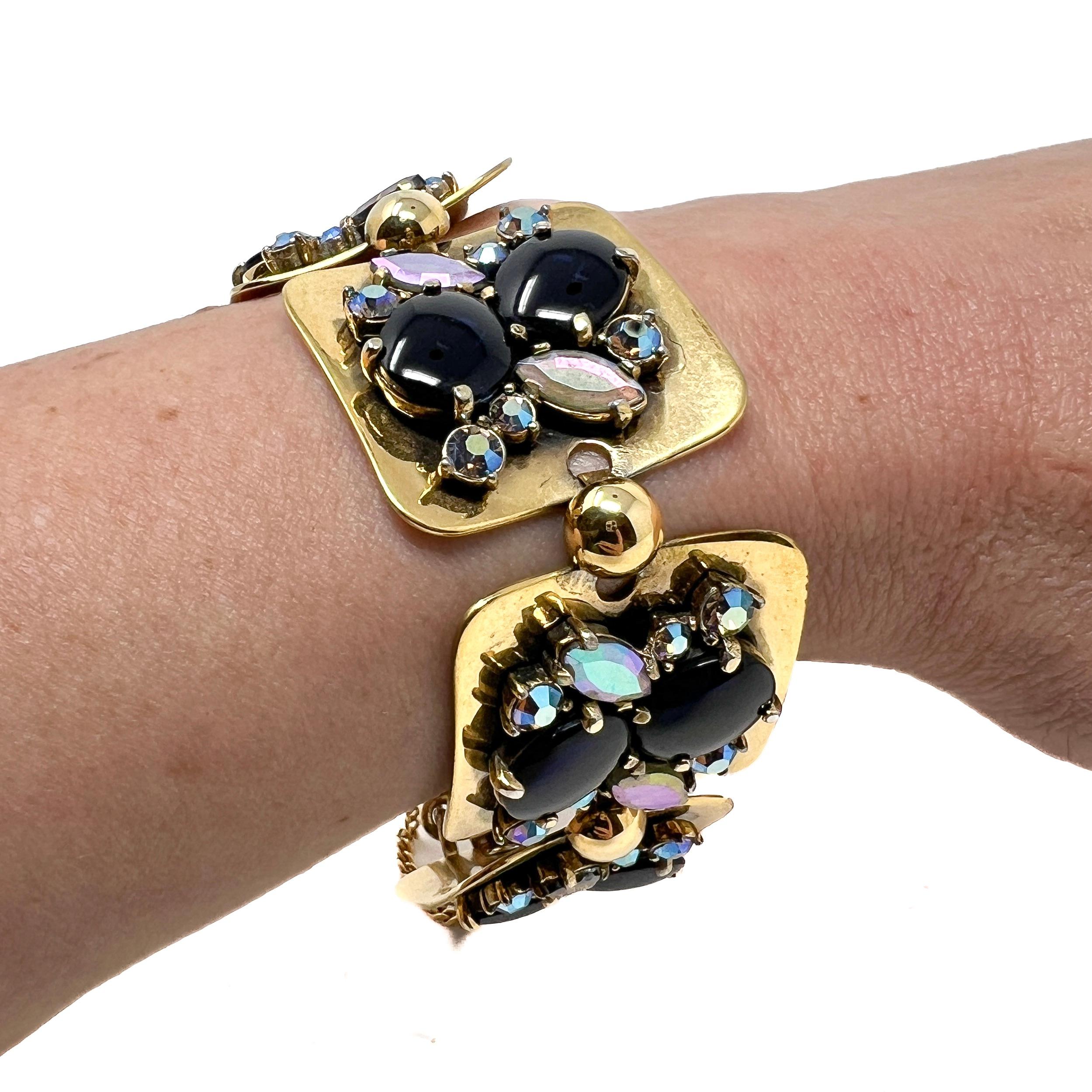 A beautiful bracelet by a much sought after maker of costume jewellery. This piece dates from the late 1950s and was created by Schiaparelli.

Condition Report:
Excellent

The Details...
This gold plated bracelet features 5 square panels. Each panel