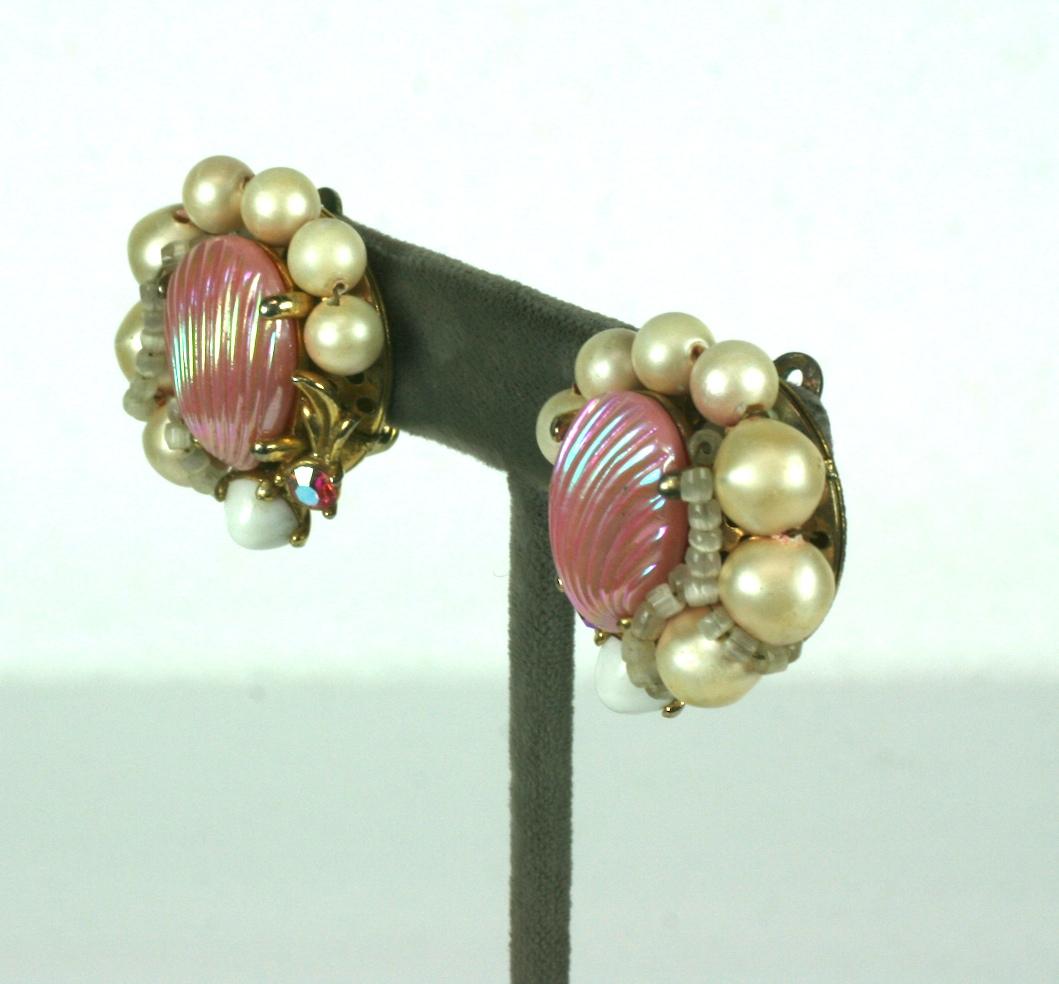 Collectible Elsa Schiaparelli Pink Shell Earrings composed of faux pink freshwater pearls, aurora crystals and moonstone beads. 1950's USA. Clip back fittings. 
1.25