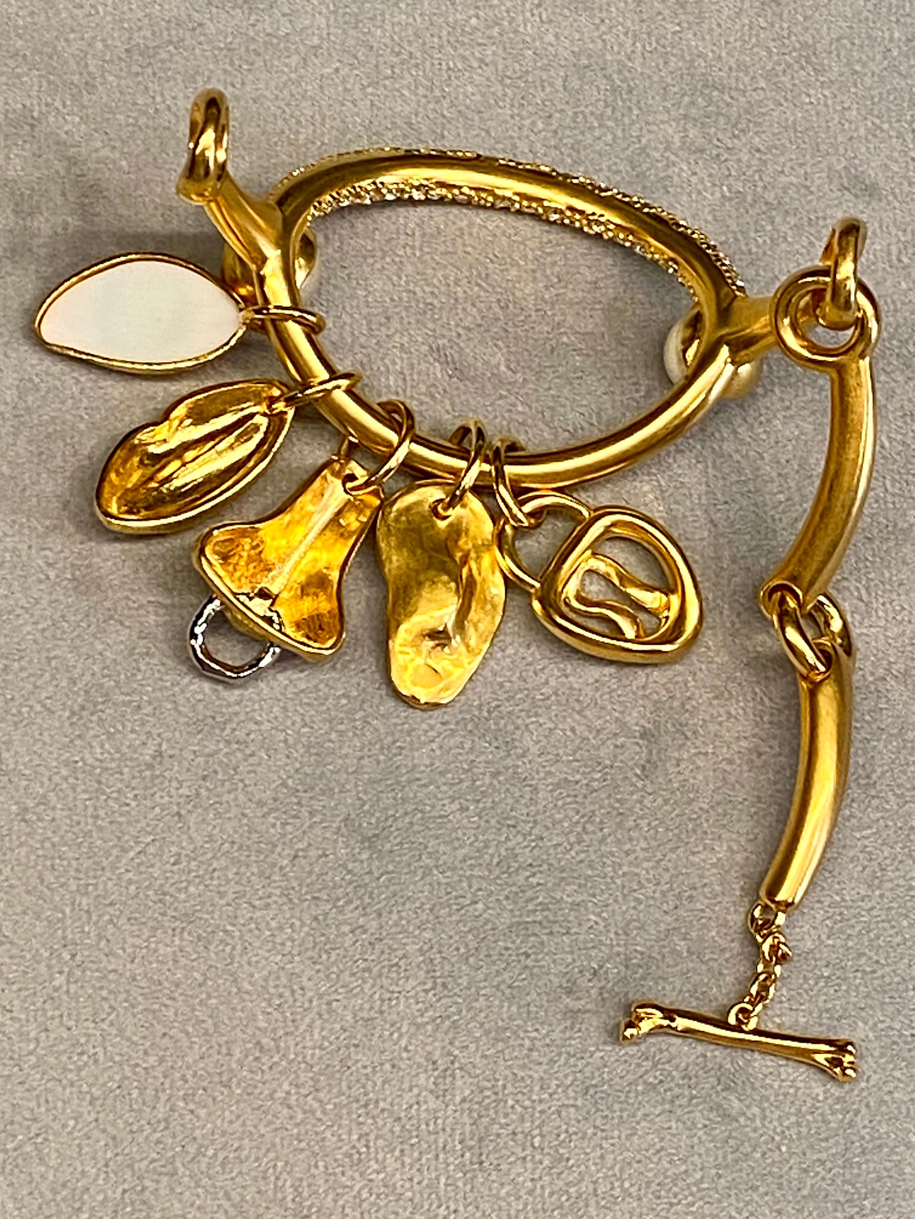 Schiaparelli Satin Gold, Pearl & Rhinestone Iconic Surrealist Charm Bracelet In Excellent Condition For Sale In New York, NY