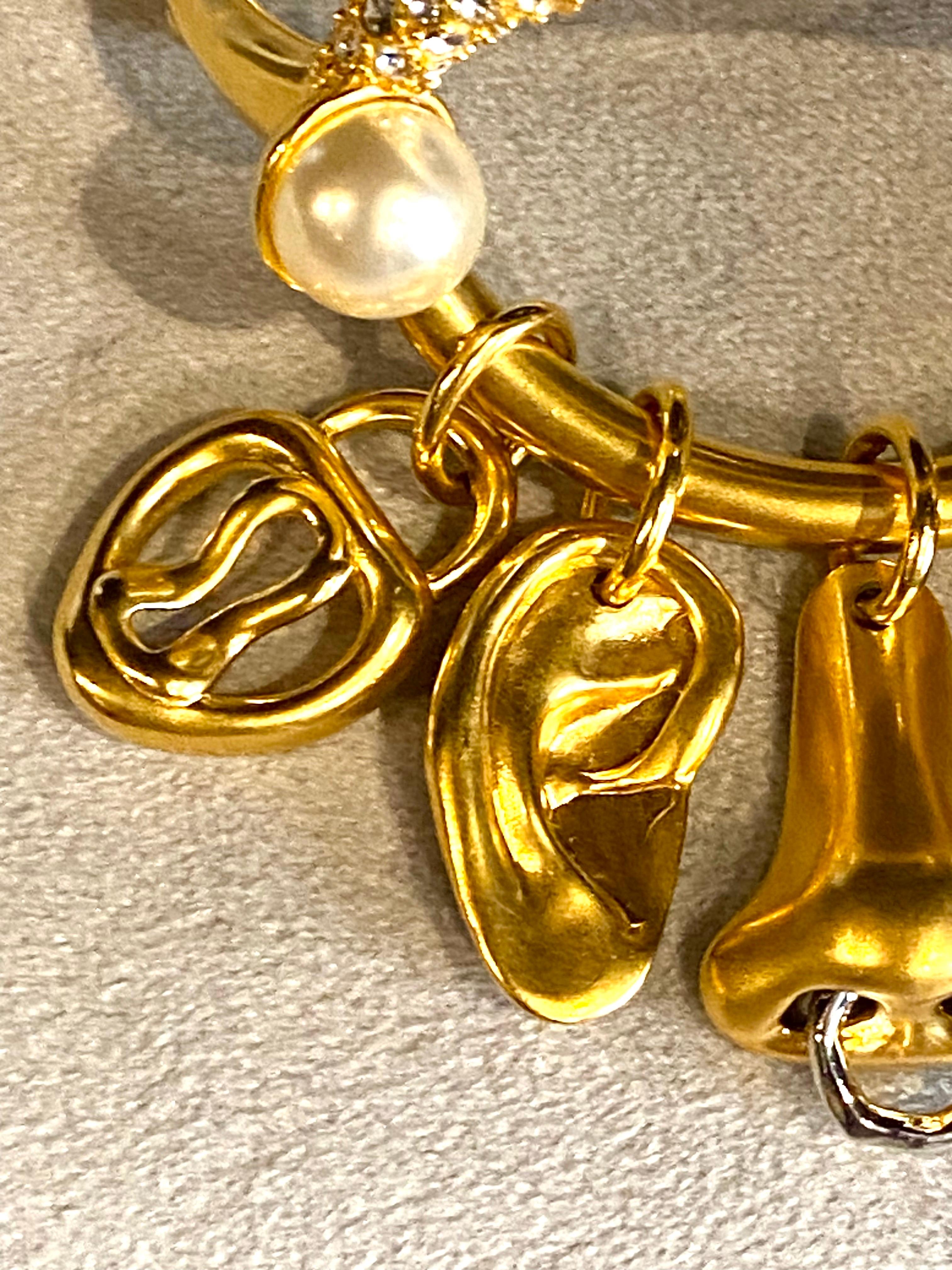 Schiaparelli Satin Gold, Pearl & Rhinestone Iconic Surrealist Charm Bracelet For Sale 2