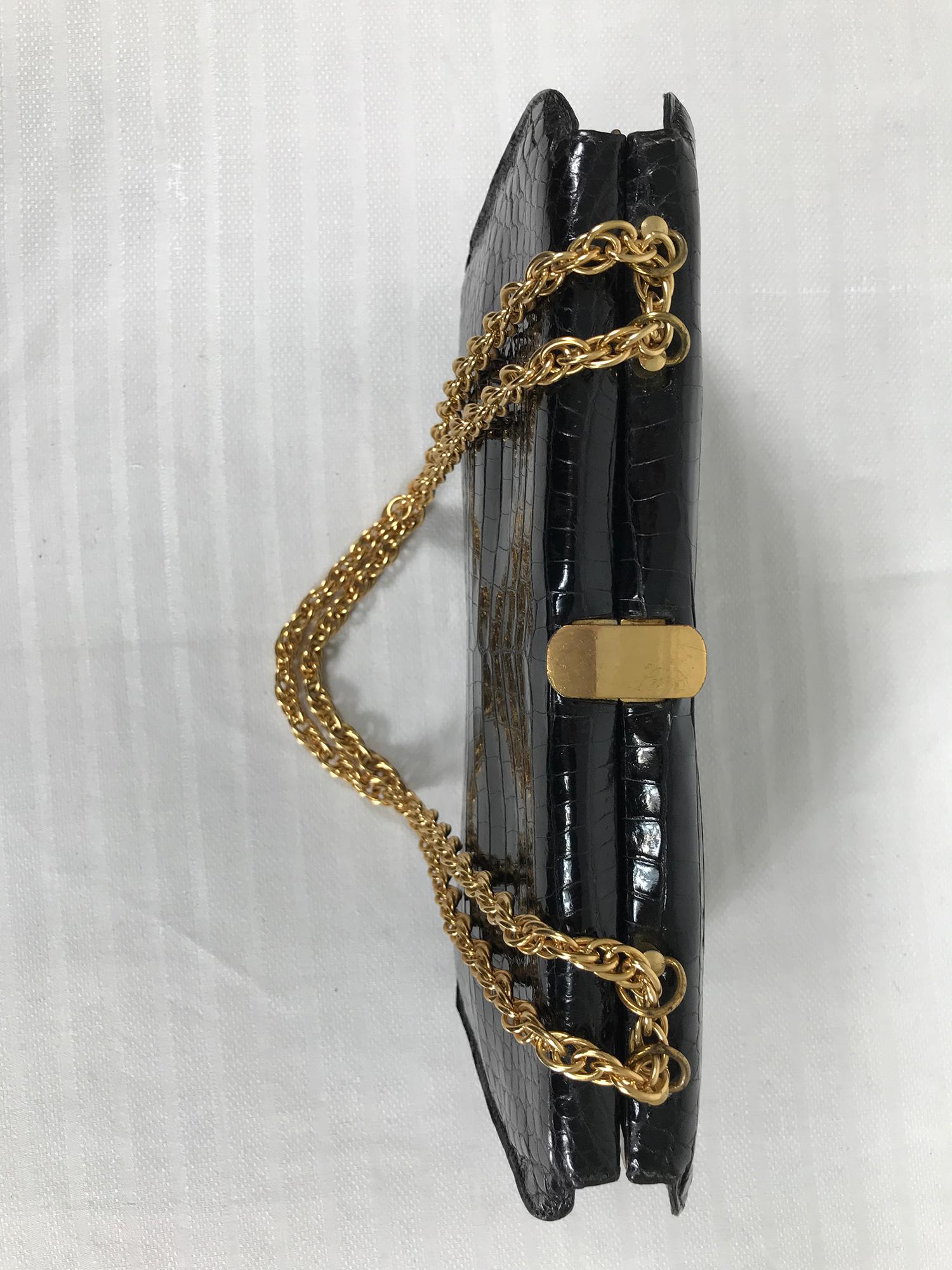 black handbag with gold hardware