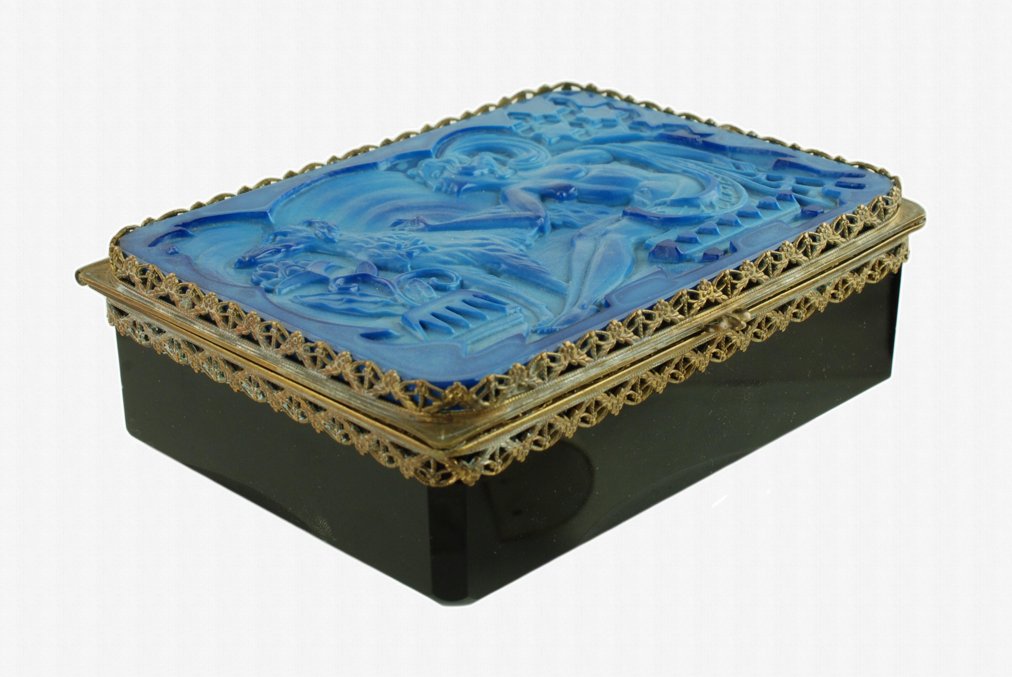 This rare Art Deco era hinged glass dresser box was made in Czechoslovakia and is part of the Ingrid series, named for the daughter of Henry Günther Schlevogt of the Curt Schlevogt glass manufactory and Charlotte Hoffman Schlevogt of the Heinrich