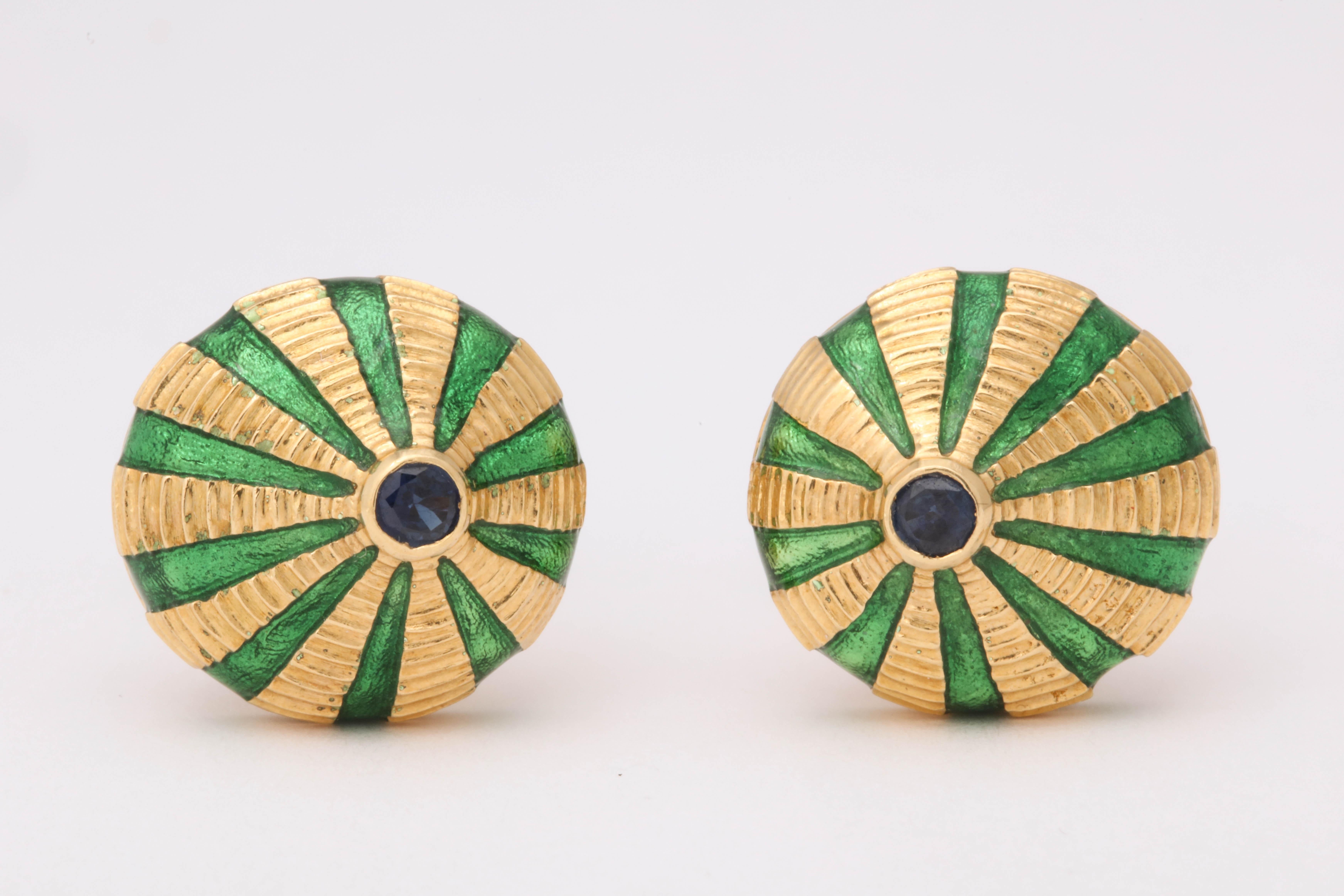 Schlumberger cufflinks for Tiffany made c. 1950. 18K yellow gold with green enamel. A sapphire is set in either end of each. 