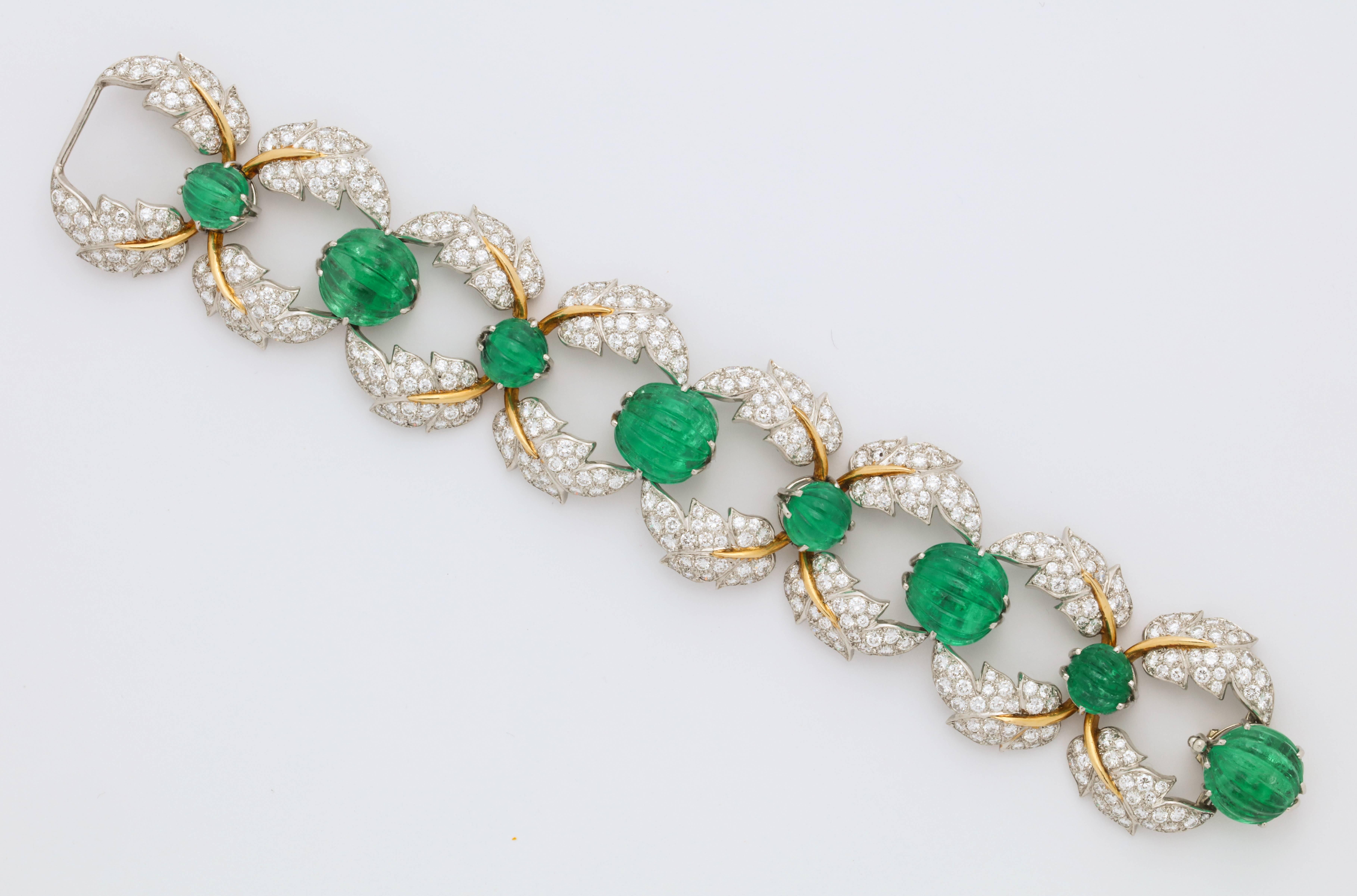 A unique and iconic set made by the legendary Jean Schlumberger for Tiffany and Co.

Set with a very rare layout of carved emeralds.

Consisting of a bracelet, earrings and necklace

Made in France circa 1960-1970

A full page image of this set is