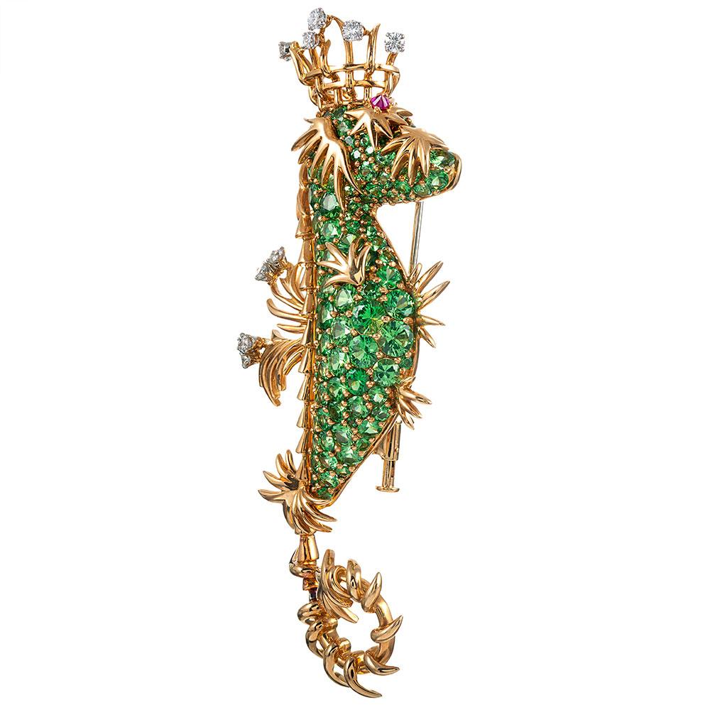 This larger-than-expected seahorse is generously appointed with green tsavorite garnets, brilliant diamonds and a ruby eye. Note the woven crown and whimsical, sculpted golden accents that bring this handsome creature to life. The diamonds weigh .80