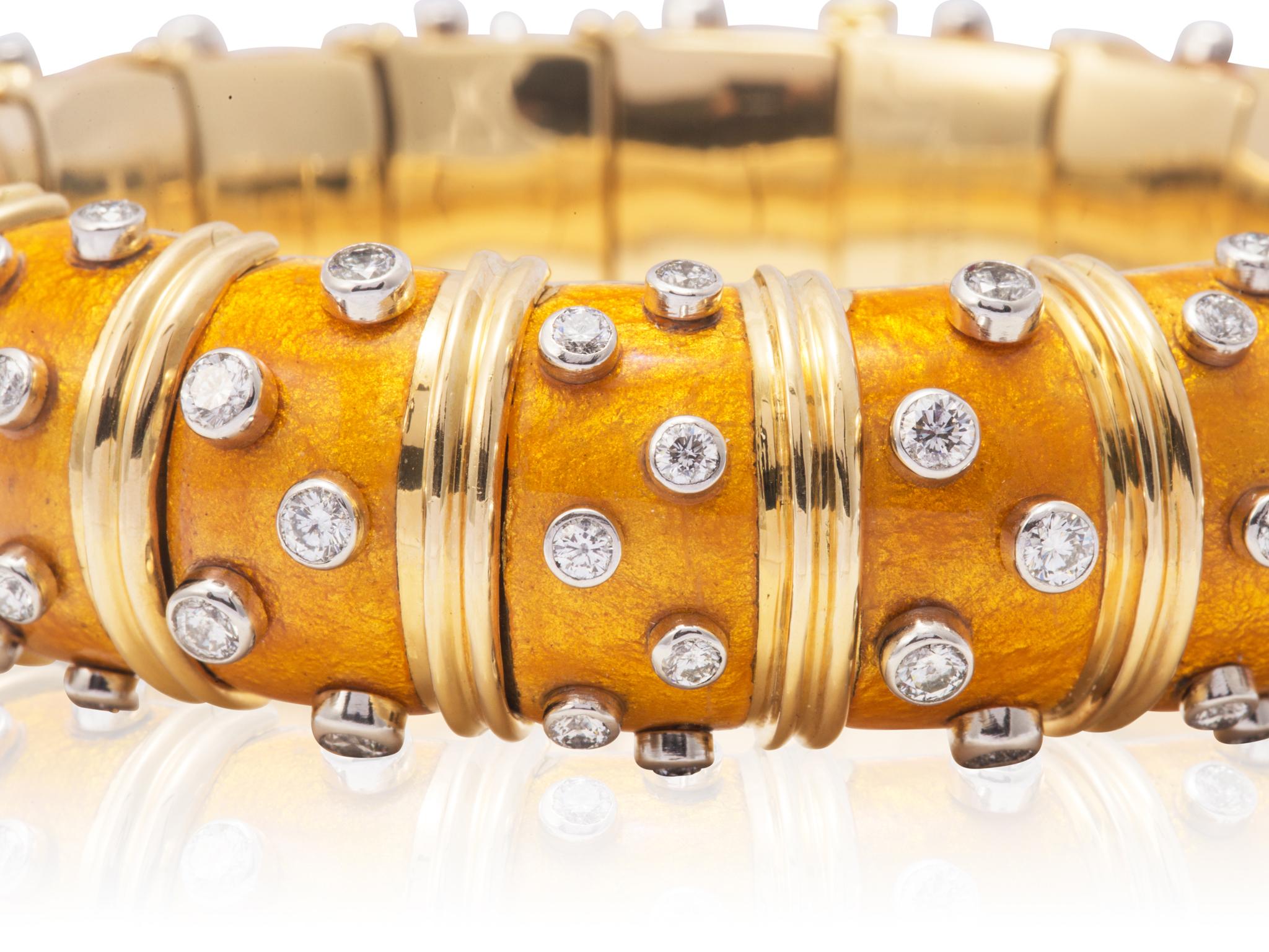 Estate 18 karat yellow gold wide yellow paillonne enamel Tiffany & Co. Schlumberger bangle bracelet with bezel set round brilliant cut diamond accents.