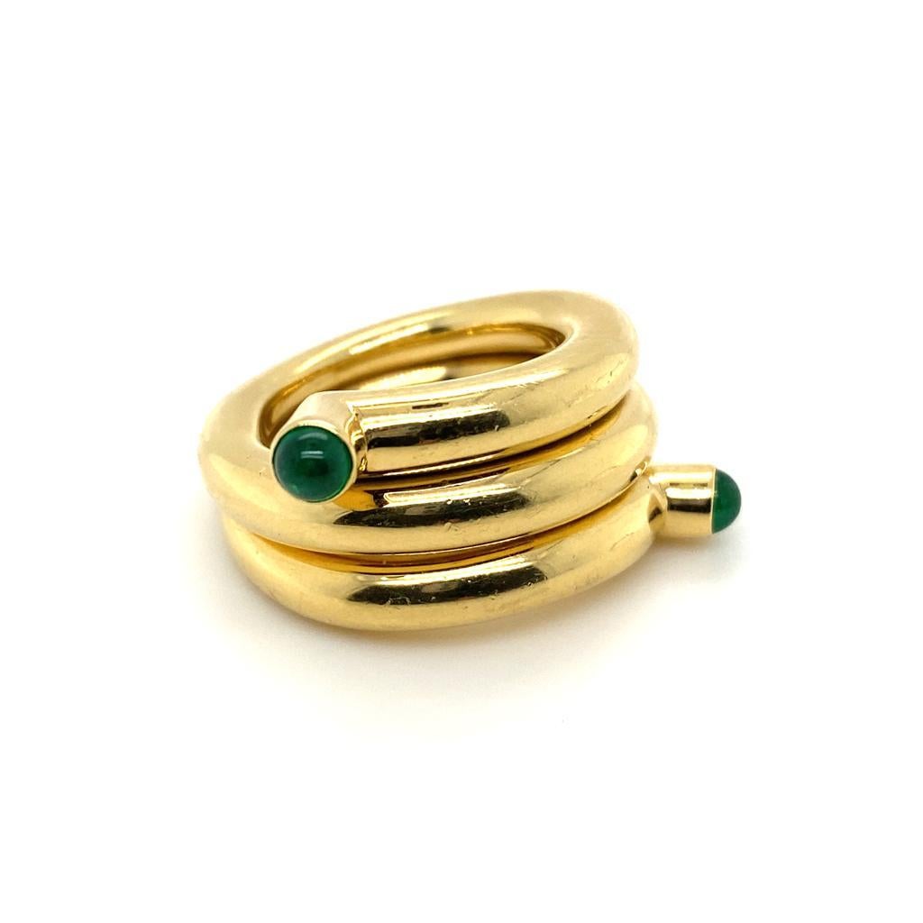 A Schlumberger Studios for Tiffany & Co 18 Karat Yellow Gold Emerald Double Coil Ring 

This unusual and striking ring is designed as a highly polished gold coil, terminating in two emerald cabochons cut stones.

The gold coils are curved making