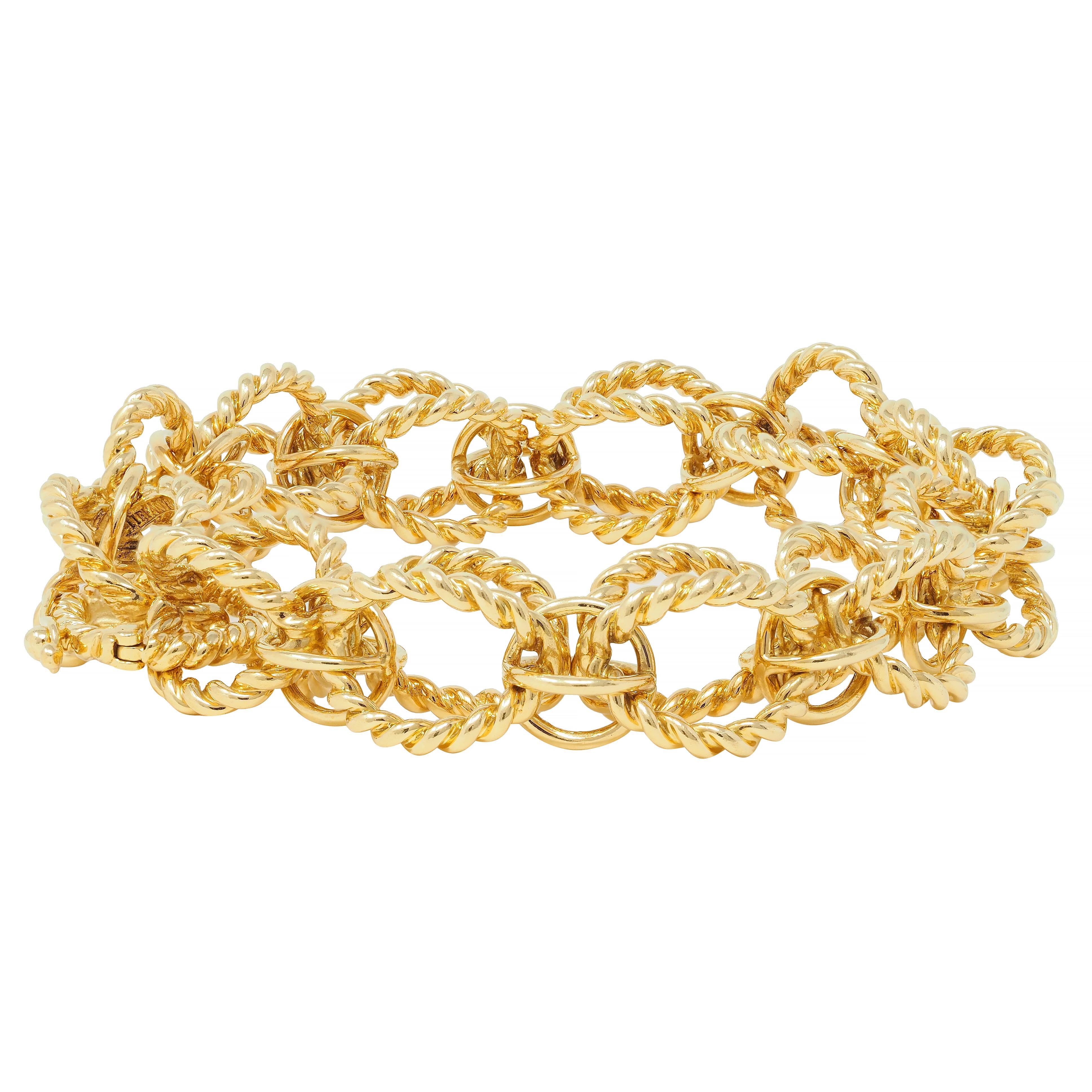 Comprised of dimensional circle links alternating in size
Large links are comprised of twisted rope motif 
Small links are smooth 
With high polish finish 
Completed by concealed clasp closure with hinged safety 
Stamped for 18 karat gold 
Fully