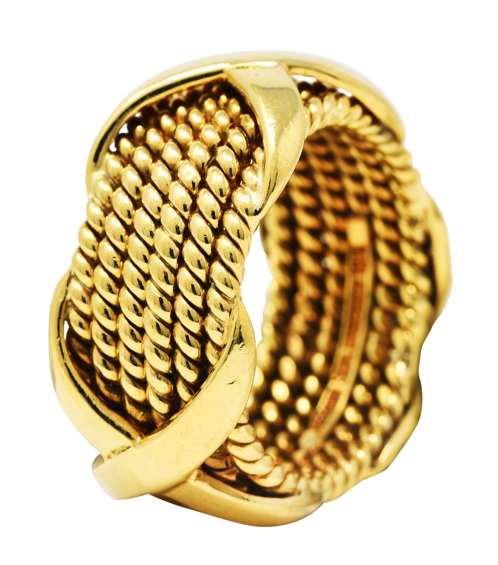 Band ring is comprised of six segments of twisted gold rope

With three stylized X stations

Stamped 18k for 18 karat gold

Numbered and fully signed Tiffany Schlumberger

For Jean Schlumberger and Tiffany & Co.

Circa: 1960's

Ring size: 6 1/2 and
