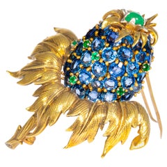 Retro Schlumberger Tiffany Co. Sapphire, Emerald and Yellow Gold Thistle Brooch