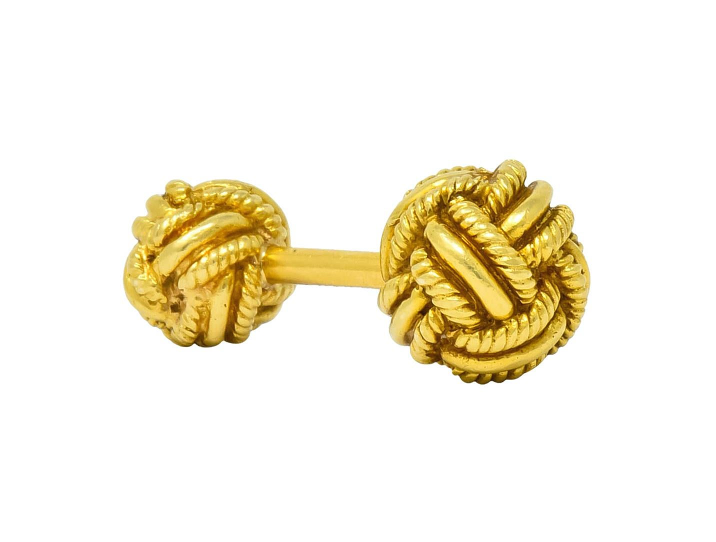 Bar style cufflinks terminating in one large knot and one small knot

Monkey's fist style knots comprised of textured, twisted rope motif

Signed Schlumberger and Tiffany

Tested as 18 karat gold

Circa 1980's

Length: 1 inch

Large knot measures: