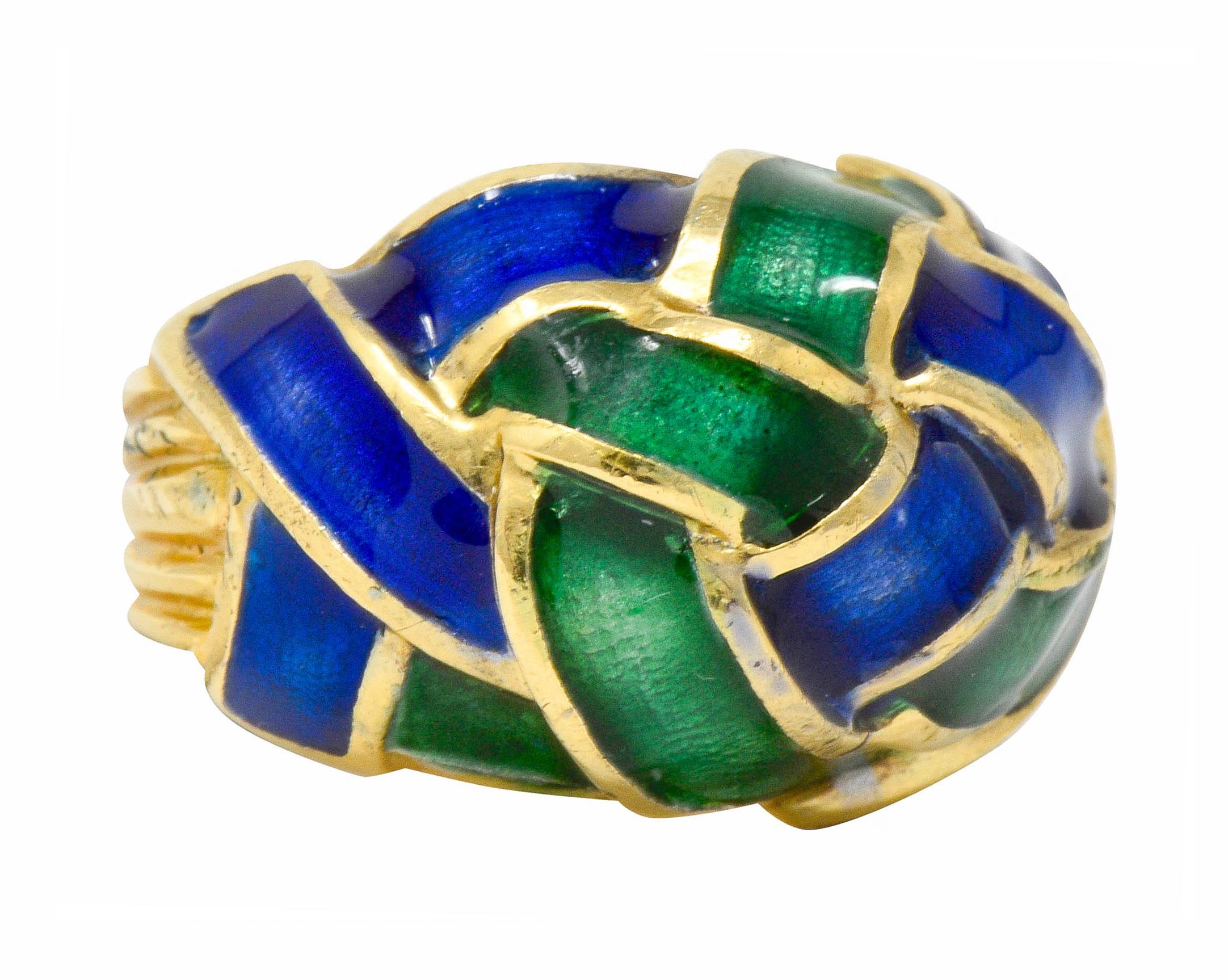 Bombé style ring designed as overlapping segments in a woven knot motif

Glossed with bright blue and green enamel, exhibiting no loss

Completed by a deeply grooved shank

Signed Tiffany Schlumberger

Tested as 18 karat gold

Circa: 1970s

Ring