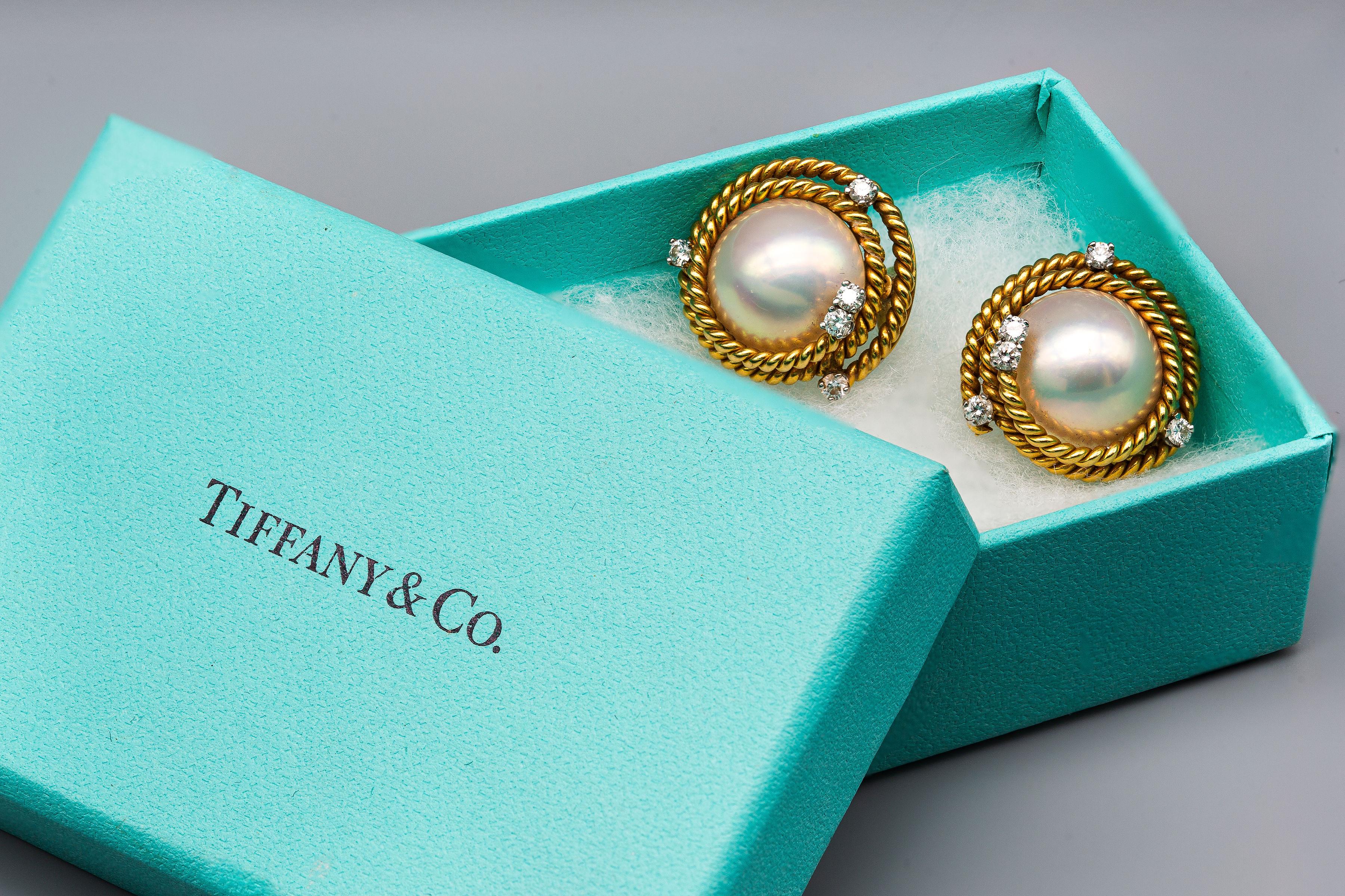 Brand: Tiffany & Co.
Designer: Schlumberger
Material: 18k & Platinum (stamped 750 and PT 950)
Gesmtones: Diamond 0.50 cttw
Pearl 15 mm x 15 mm x 9.7 mm
Weight: 20.9 grams
Dimensions: 21.9 mm x 21.8 mm x 16.6 mm

Stunning classic Tiffany earrings