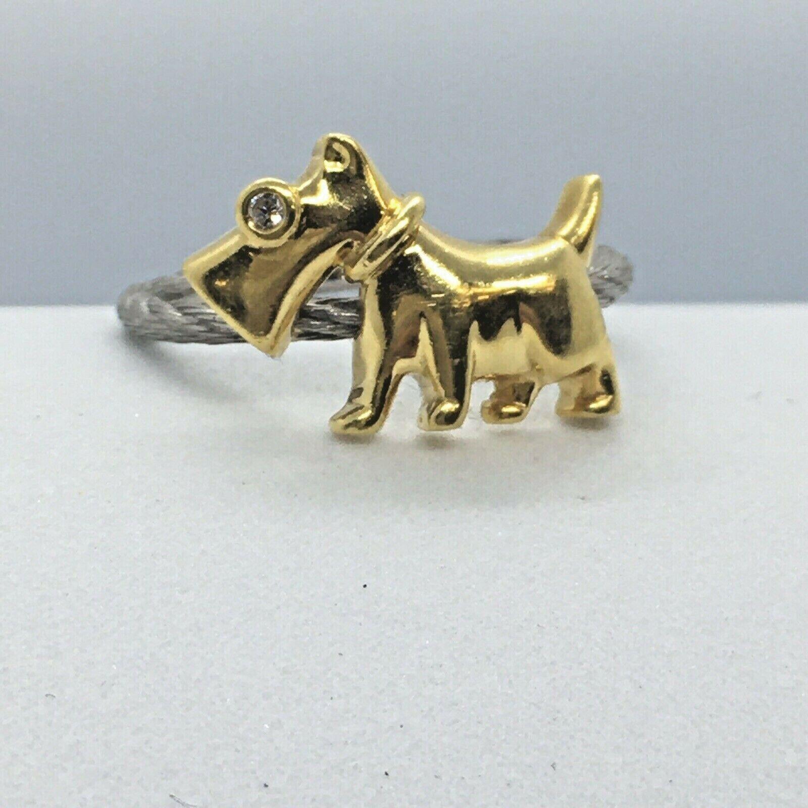 Schnauzer White Yellow 18k Gold Handmade Diamond Ring

Size 6.5
Weighing 4.4 grams
1/2 inch top  
Marked 'K18', 'K18WG' , tested 18K Gold
Small Diamond eye
In excellent pre-owned condition, no evidence of repairs, never sized, no damage, see pictures