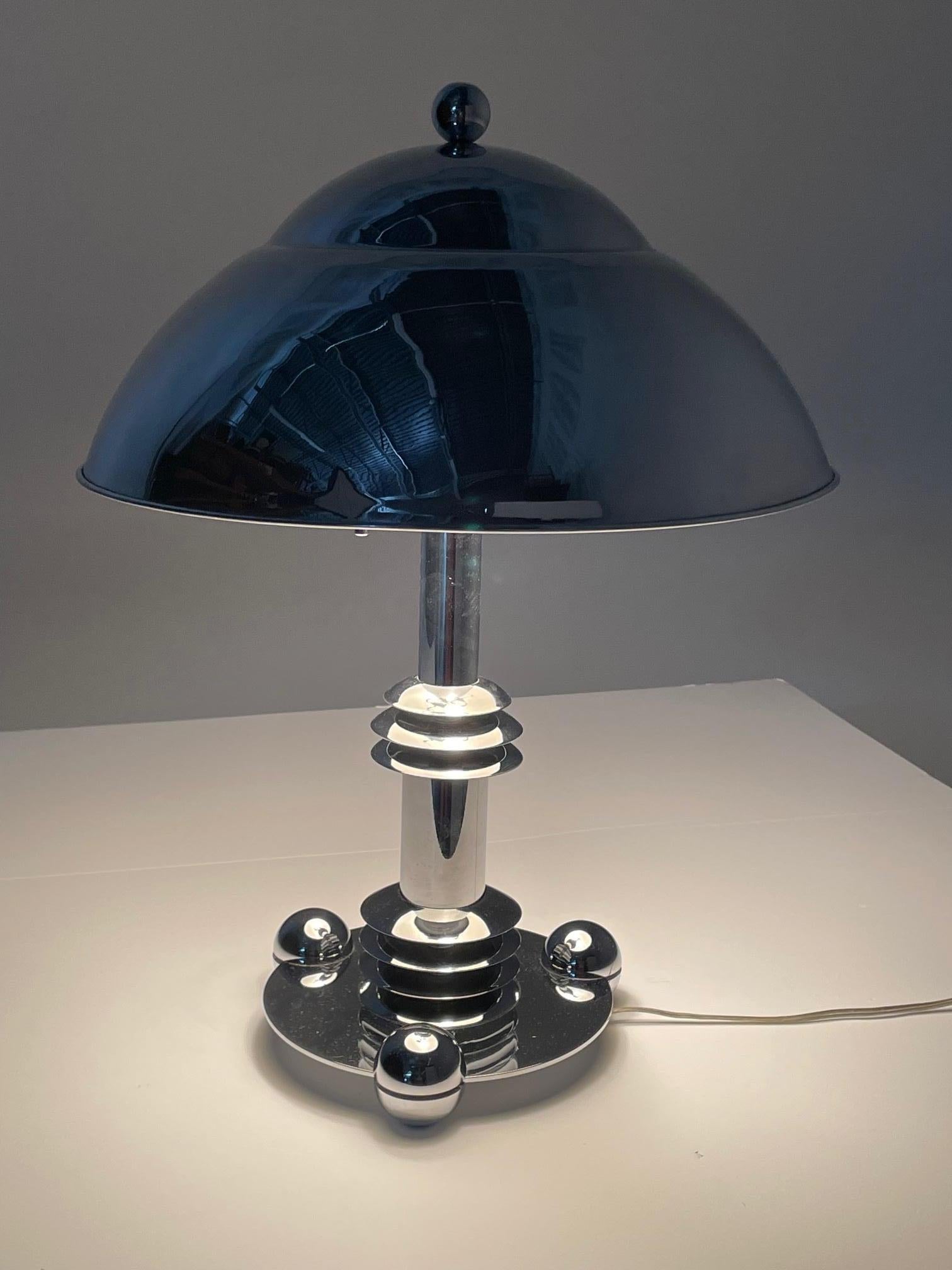 Great machine age designed Jay Spectre for Paul Hansen shiny chrome desk or table lamp having dome shaped shade lined in white laquer.