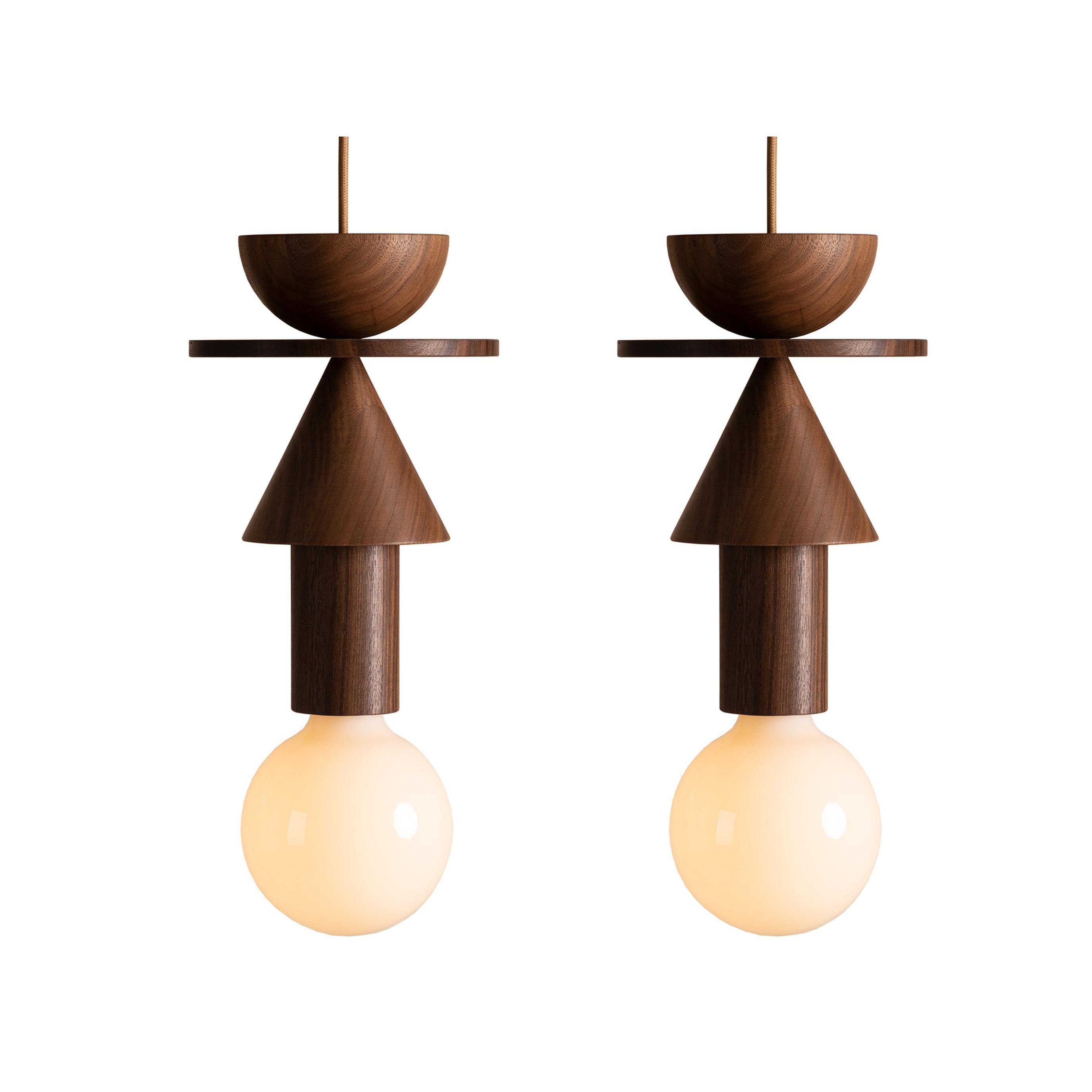Schneid's distinctive Junit lamp, inspired by the Bauhaus movement and usually known for its variety of colors, now gets the chance to express its abstract forms with full elegance through the warmth and naturalness of walnut wood. As a tribute to