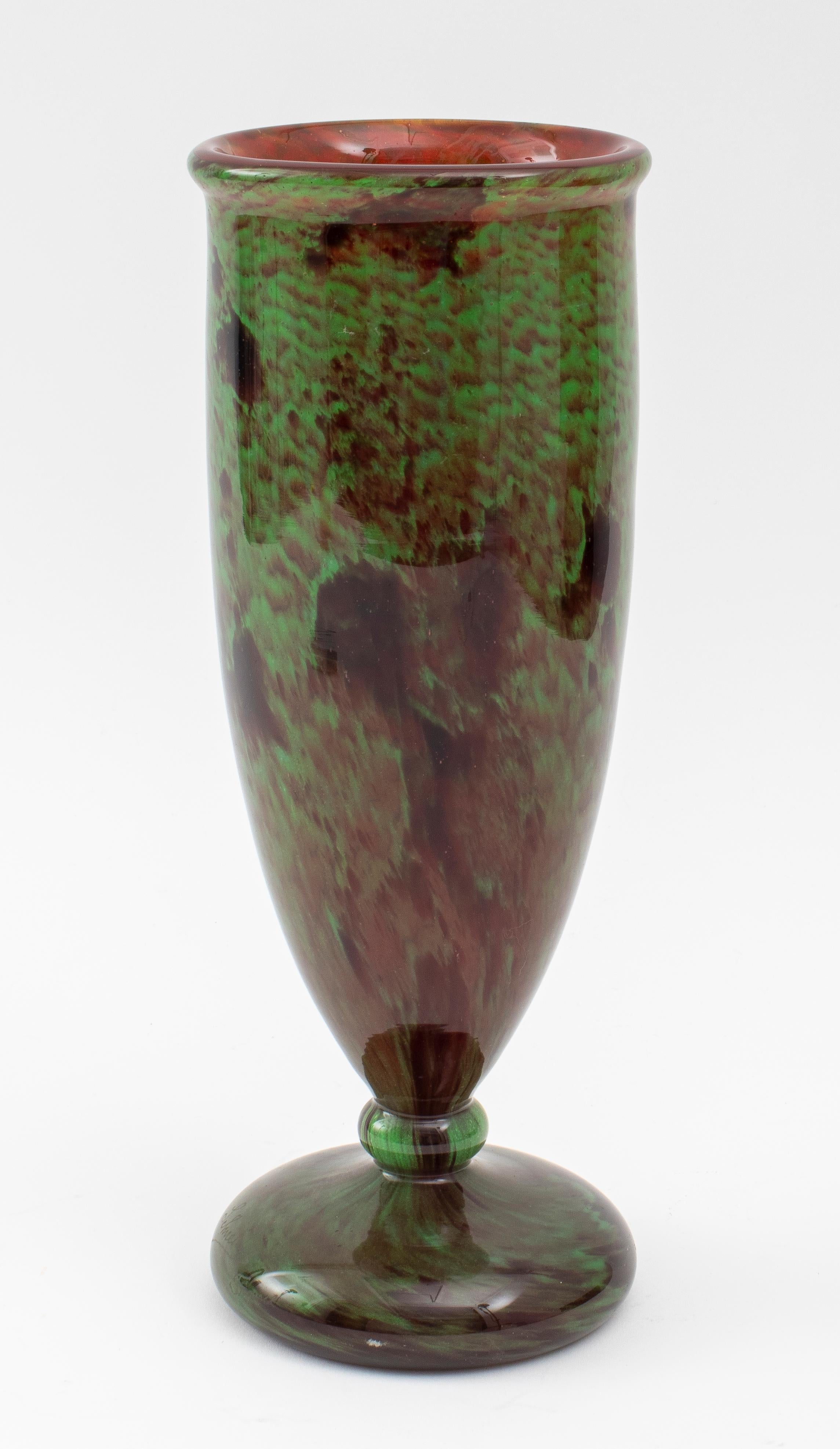 French Schneider Art Deco glass pedestal vase, circa 1920, in mottled green and earth-tone colors with a flared lip and applied knopped circular foot, marked 