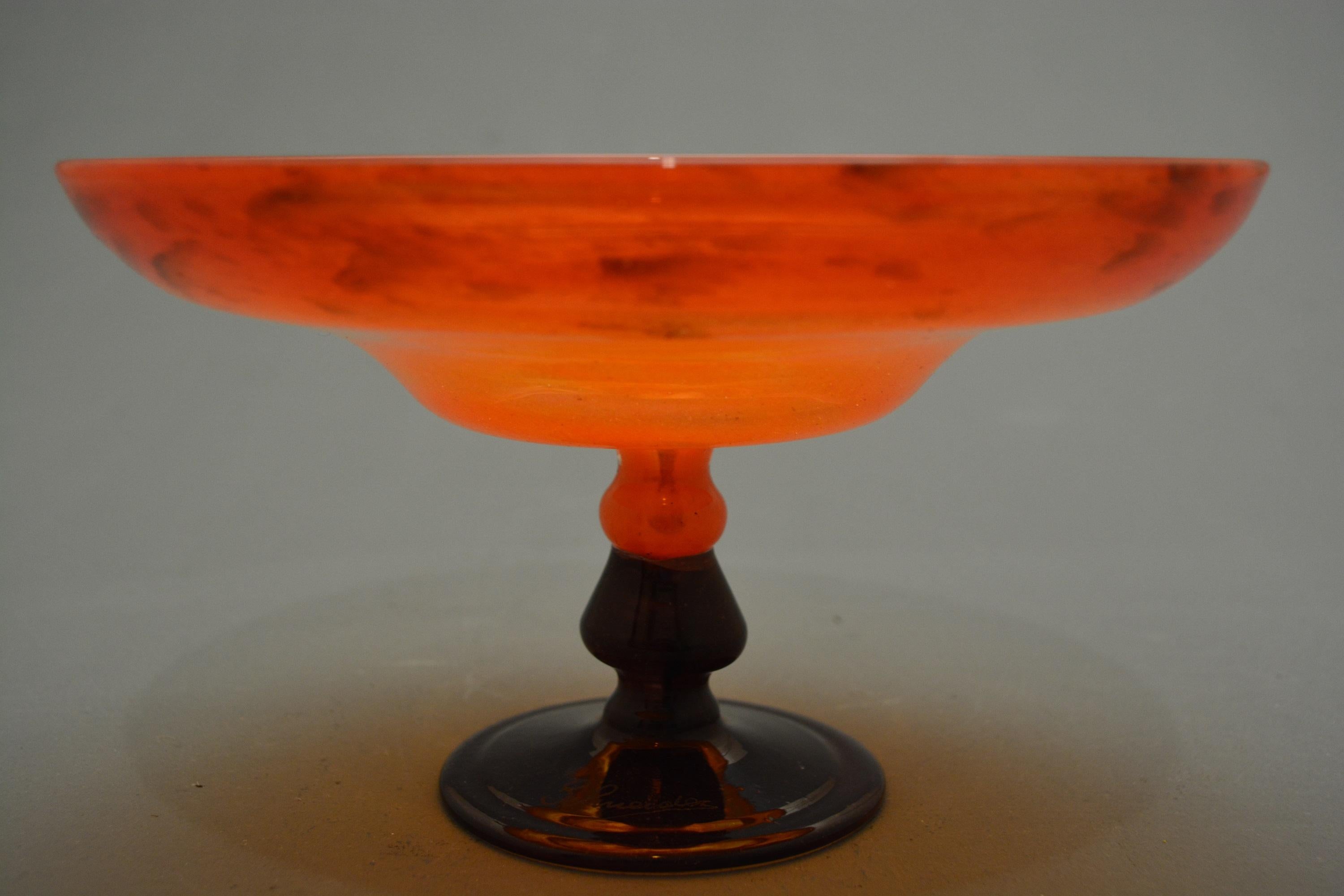 Goblet of wavy profile in orange powdered glass, violet knob and foot.
Schneider production.
Schneider engraved sign on the foot. 
Published on 1984 Louvre des Antiquaires catalogue page 37 and on the cover.
 To be place in a nice collection or