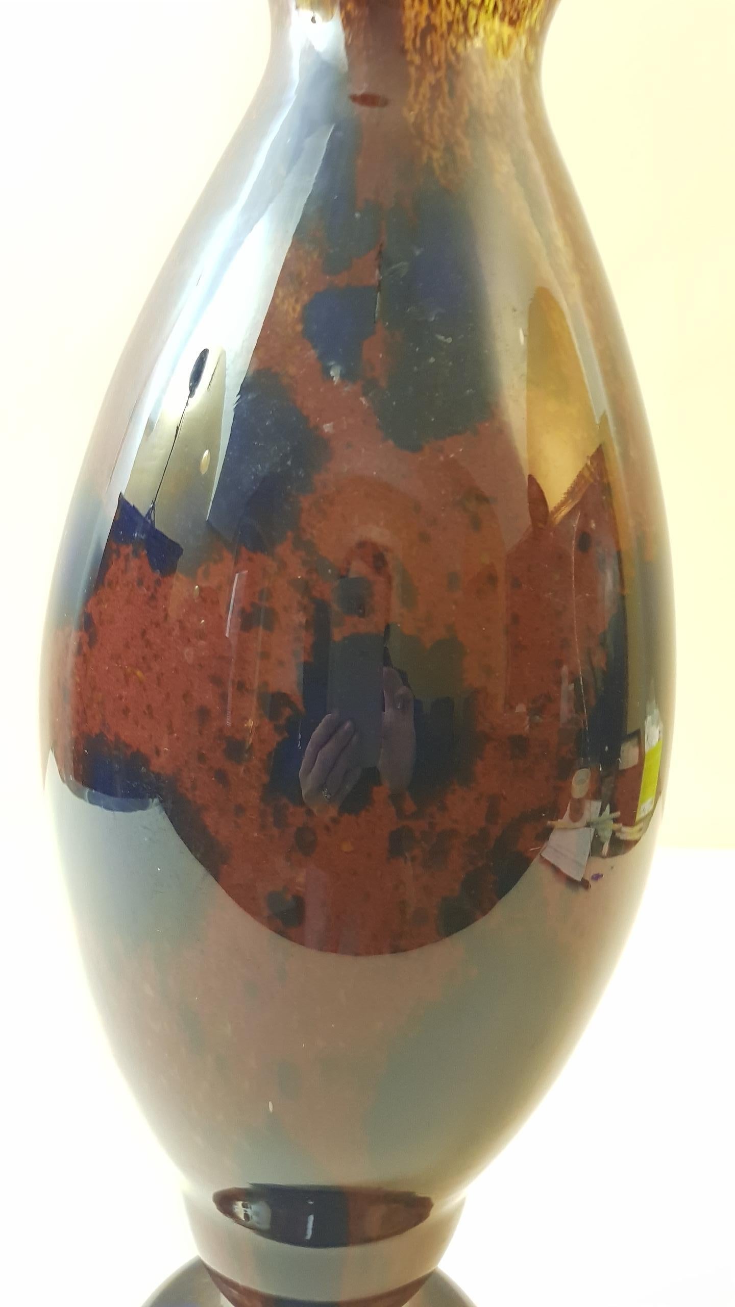 Spectacular  big glass vase of the Jades series of Schneider with polychrome blue, brown and yellow oval shaped pivots on base and flared neck.
Characterized by an imposing size that does not go to the detriment of the beautiful shape and the rich