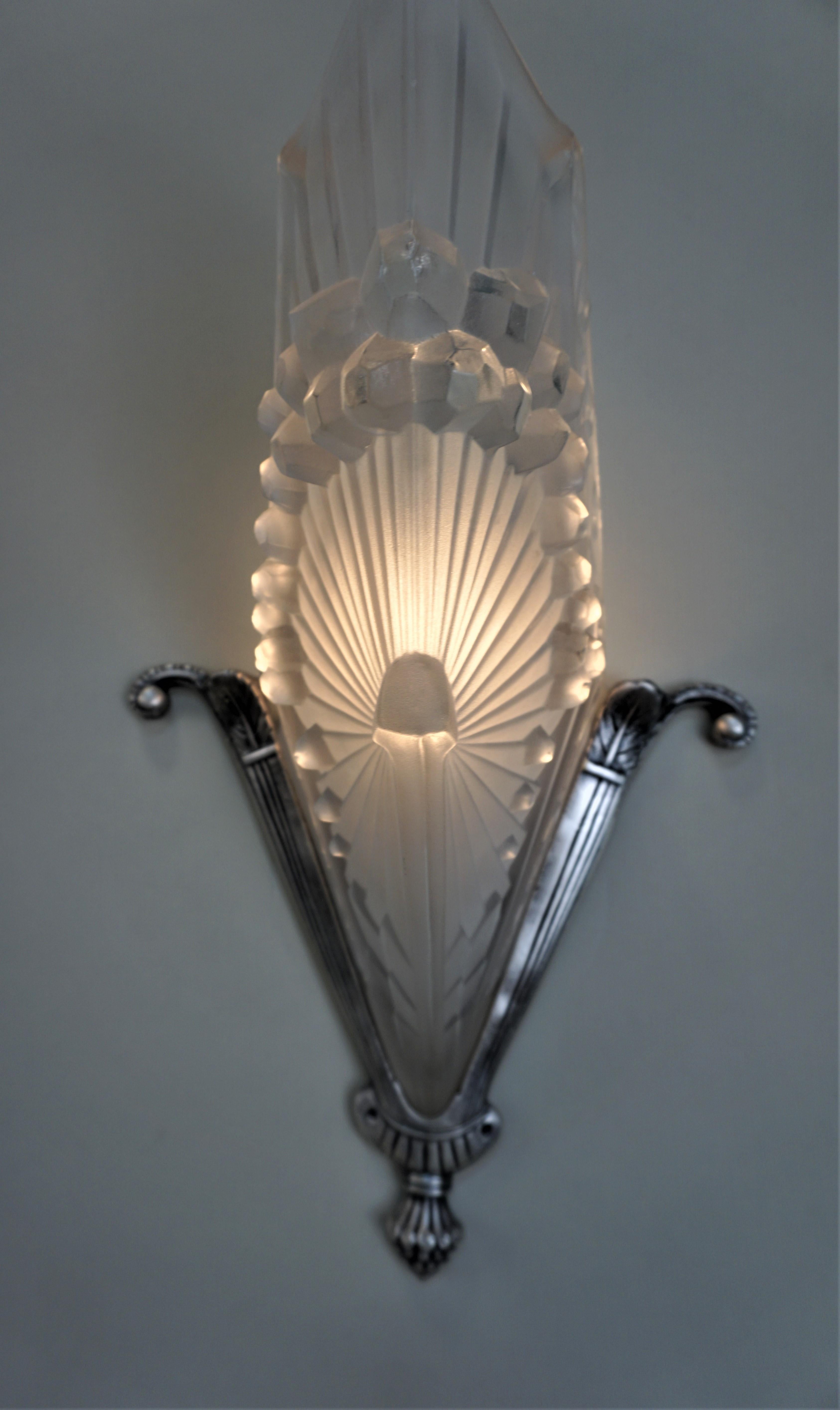 Pair of 1930s French Art Deco clear Frost glass with nickel on bronze wall sconces.