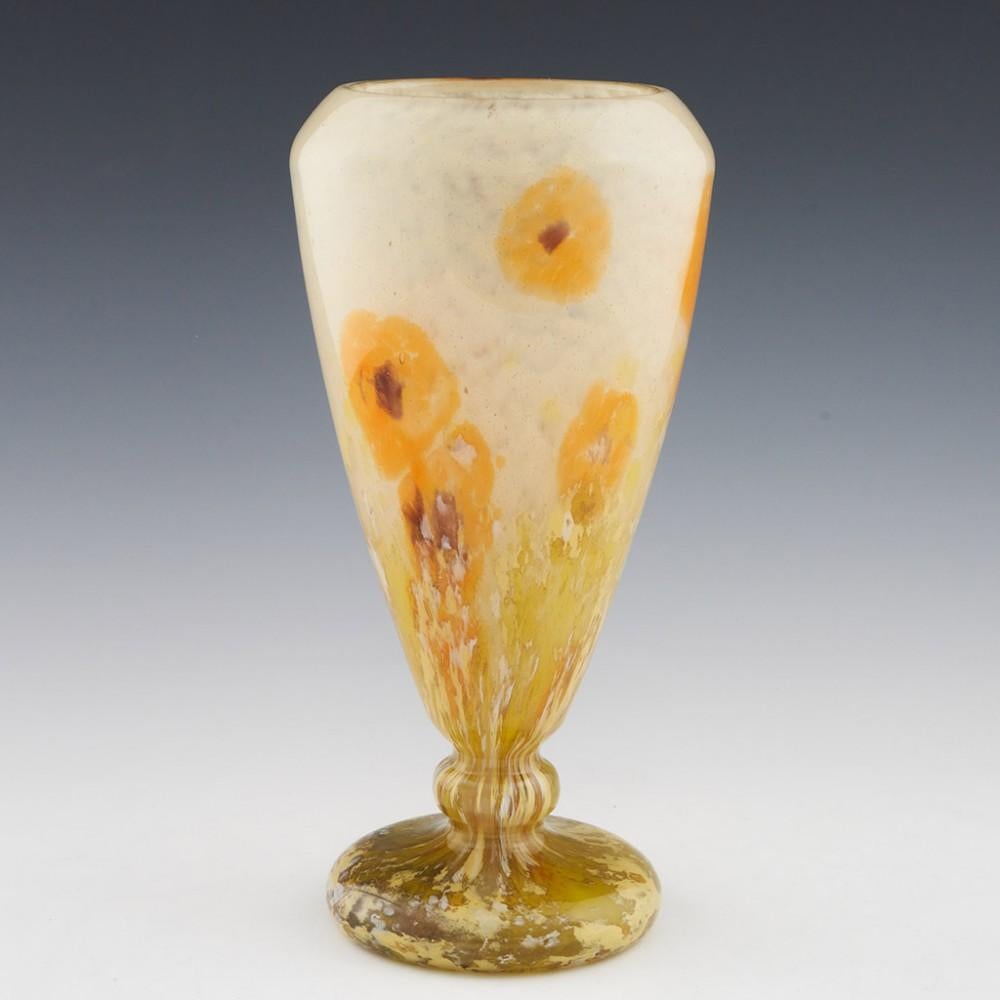 A Schneider Poppies vase made between 1927 and 1930 in Epinay-sur-Seine, Paris, France. The bowl features mottled white transitioning to marbled green. Swatches of orange with violet centres

An expertly produced piece of cratsmanship. The flowers