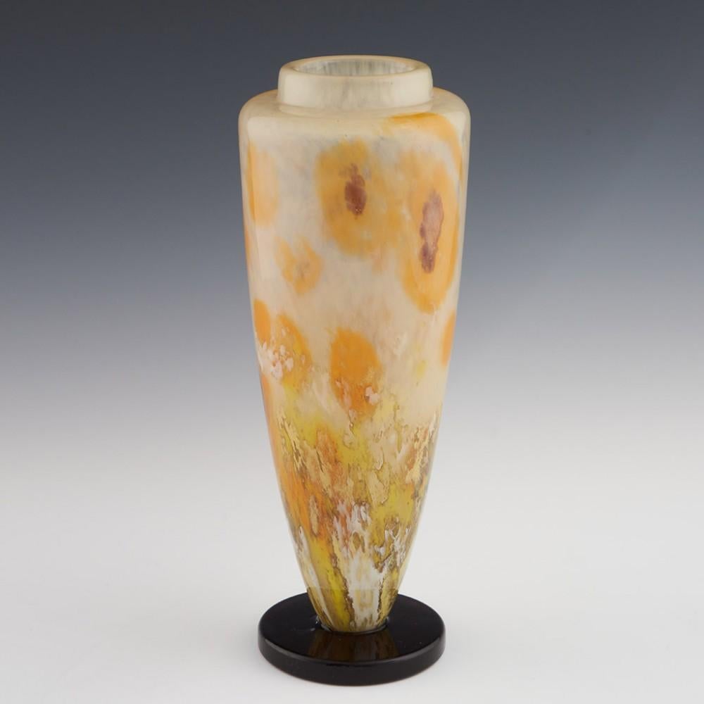 Heading : Schneider Verre Francais poppie vase
Date : 1927-30
Origin : Epinay-sur-Seine, France
Bowl Features : Mottled orange, white, marbled greens, and violets depicting poppies. Violet foot
Marks : Signed Schneider to the foot
Type : Lead
Size :