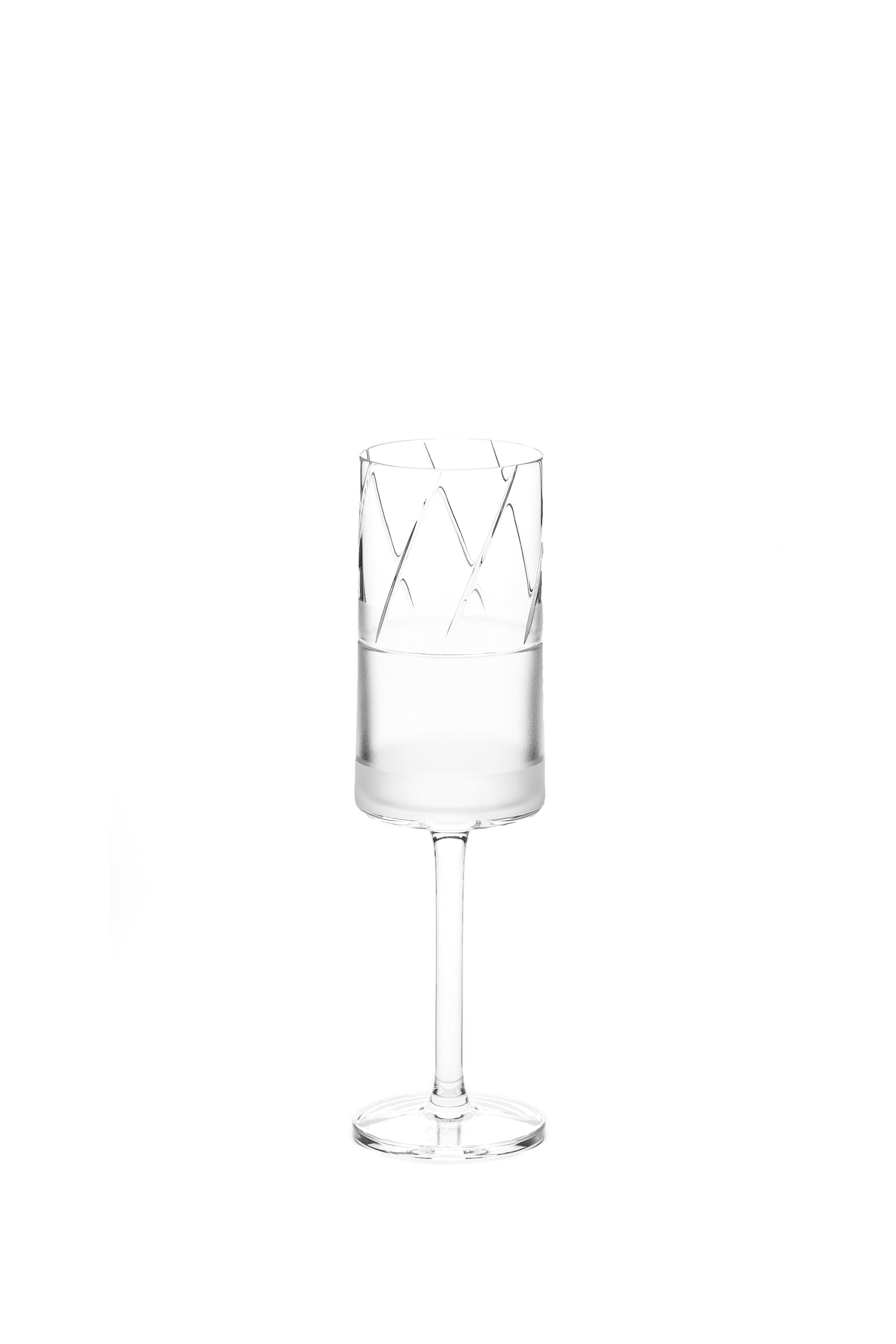 A champagne glass made by hand
Glass designed by Scholten & Baijings as part of our 'ELEMENTS' series.

The Collection: Elements
A rich canon of graphic markings defines the ELEMENTS series of lead crystal. Cuts and textures of varying depth and