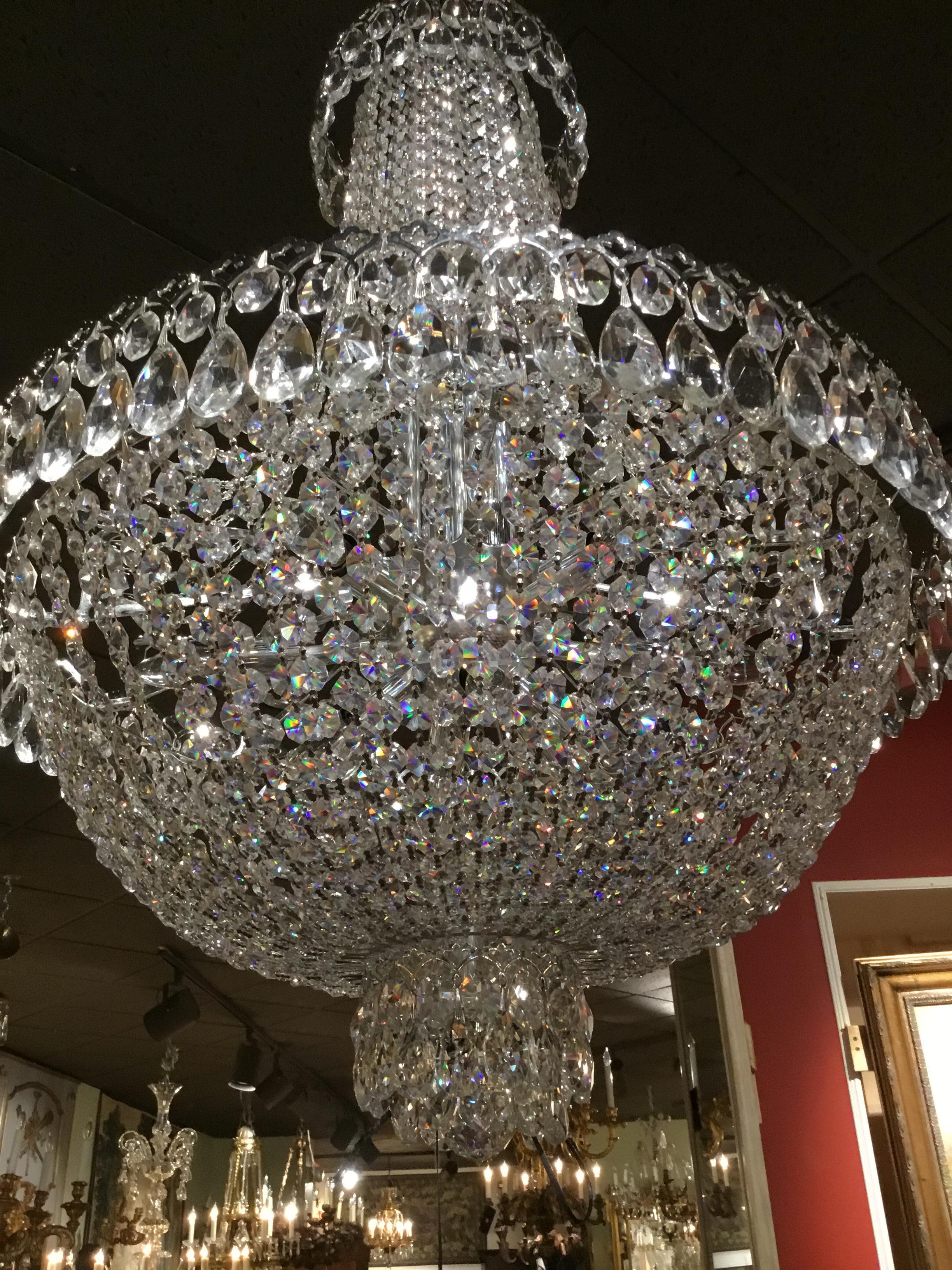 Brilliant crystal by Schonbek in an Empire style. The crystal
Is clean, clear and brilliant with a metal work in a silver patina.
The wiring is complete and the fixture is in very good condition 