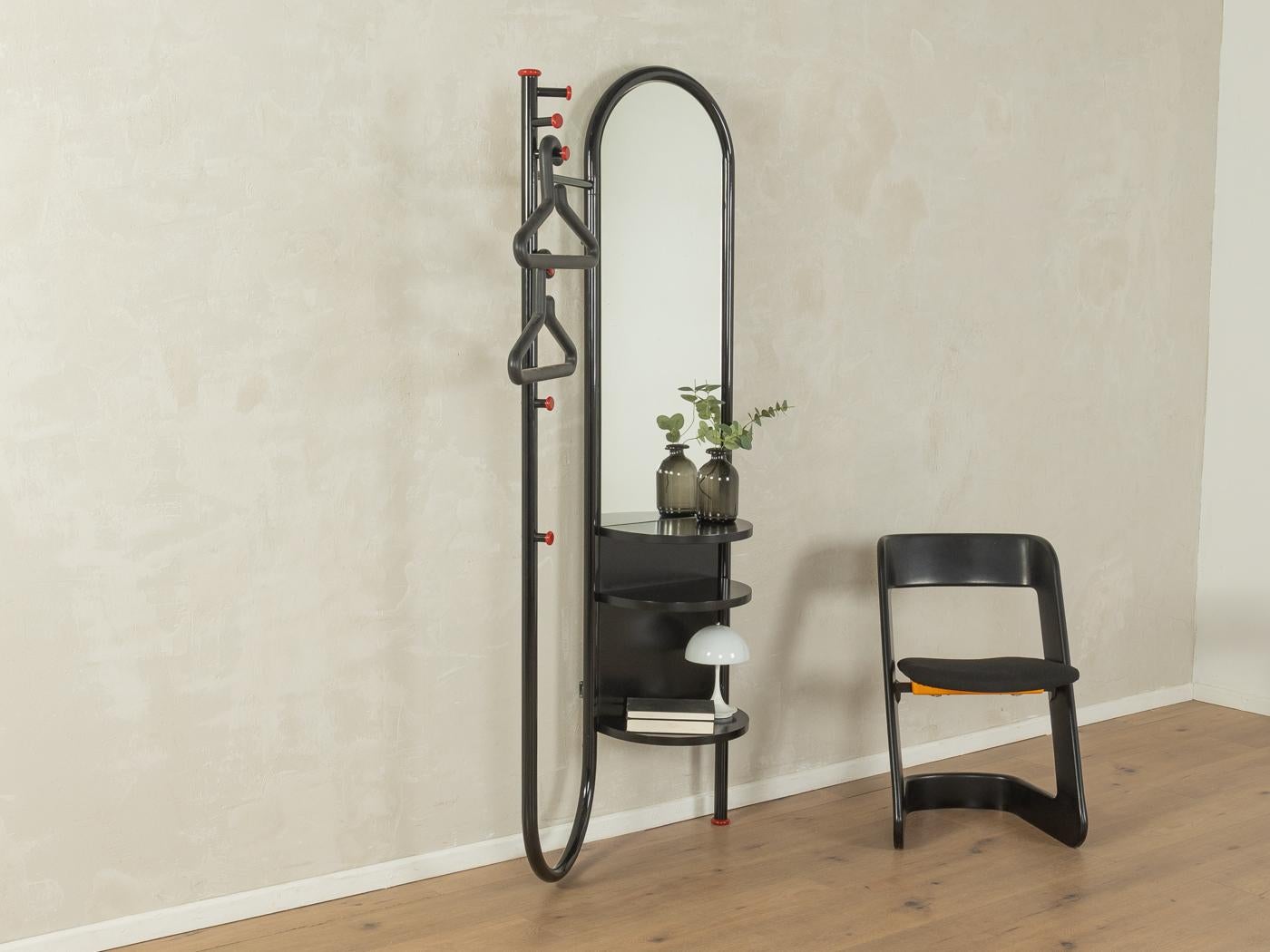 Postmodern coat rack by Schönbuch from the 1970s. Black lacquered metal frame with a mirror and three shelves.

Quality Features:
very good workmanship
high quality materials
Made in Germany. manufacturer: Schönbuch (Branding on the rear)