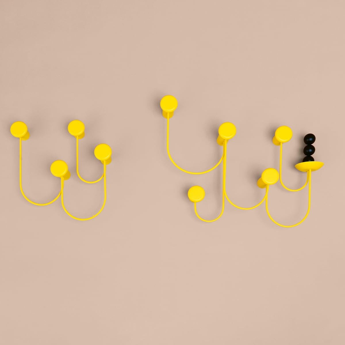 Inspiring installation. PINA is a wall-mounted coat rack and an absolute eye-catcher. Designed by Laurent Batisse, it immediately calls to mind a series of dance steps with a strong, playful character. The coat hooks are made of powder-coated steel,