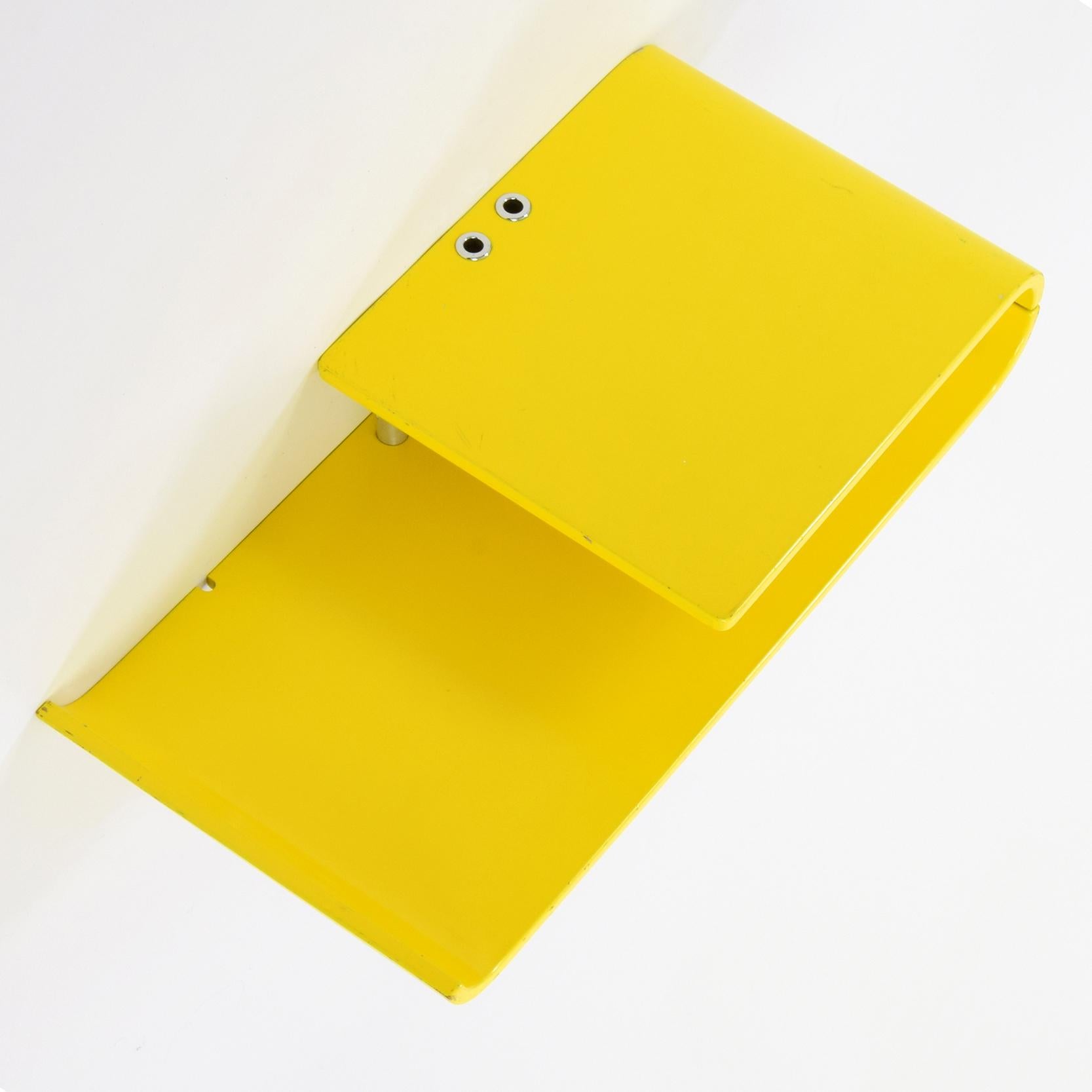 Schönbuch (manufacturer), Germany

‘Telefonkonsole’ (telephone console) wall-mounted shelf unit with pen stands.
Yellow lacquered formed plywood, metal fittings, chrome pen stands.
Manufacturer’s label to underside.

A super little shelf unit,