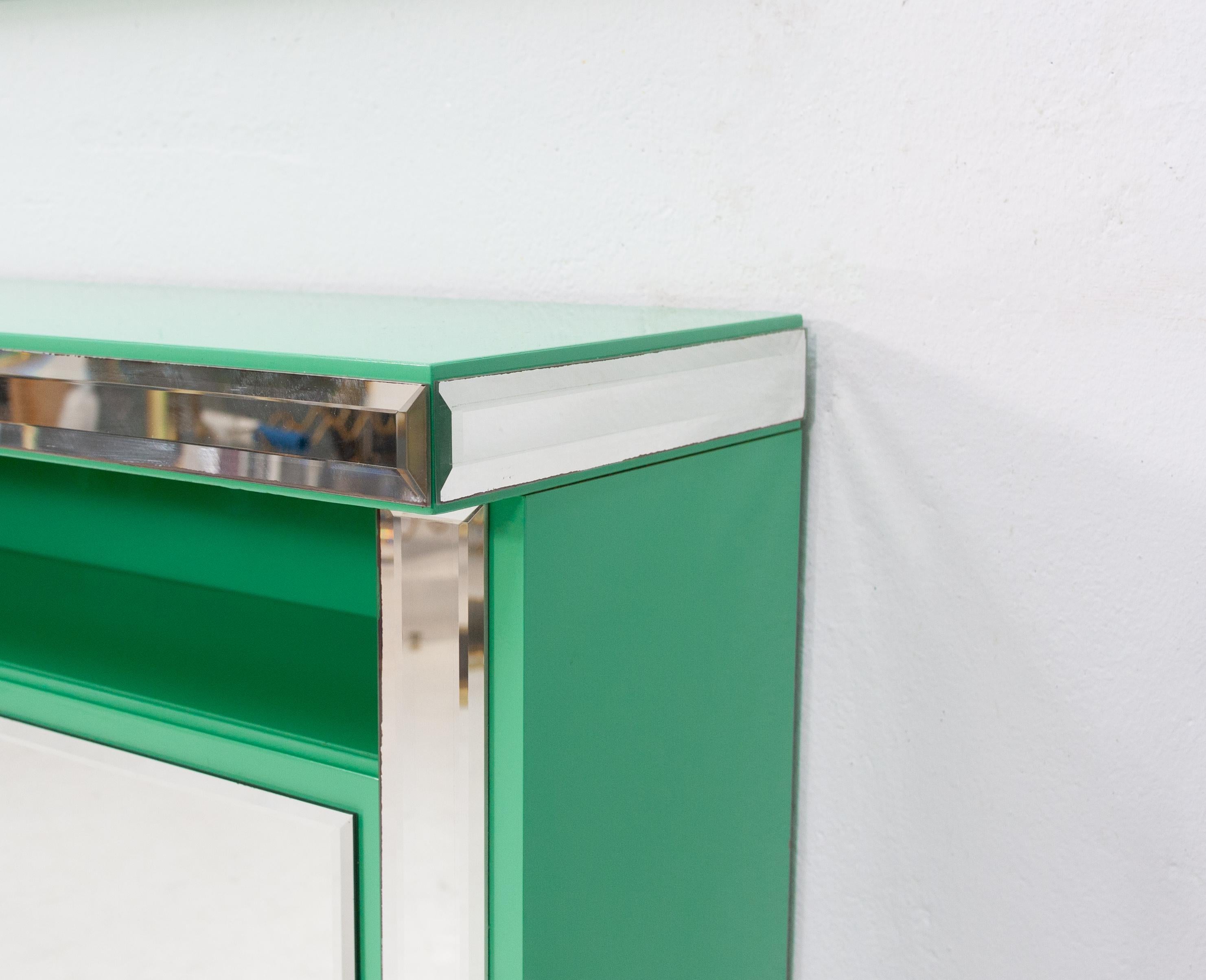Mint green console mirror. The color of this piece is spectacular, love it. Original set 
By Schöninger 1970s, cut glass mirror. Some useful storage in the console table. Still in very good condition after all these years .
Measurements console