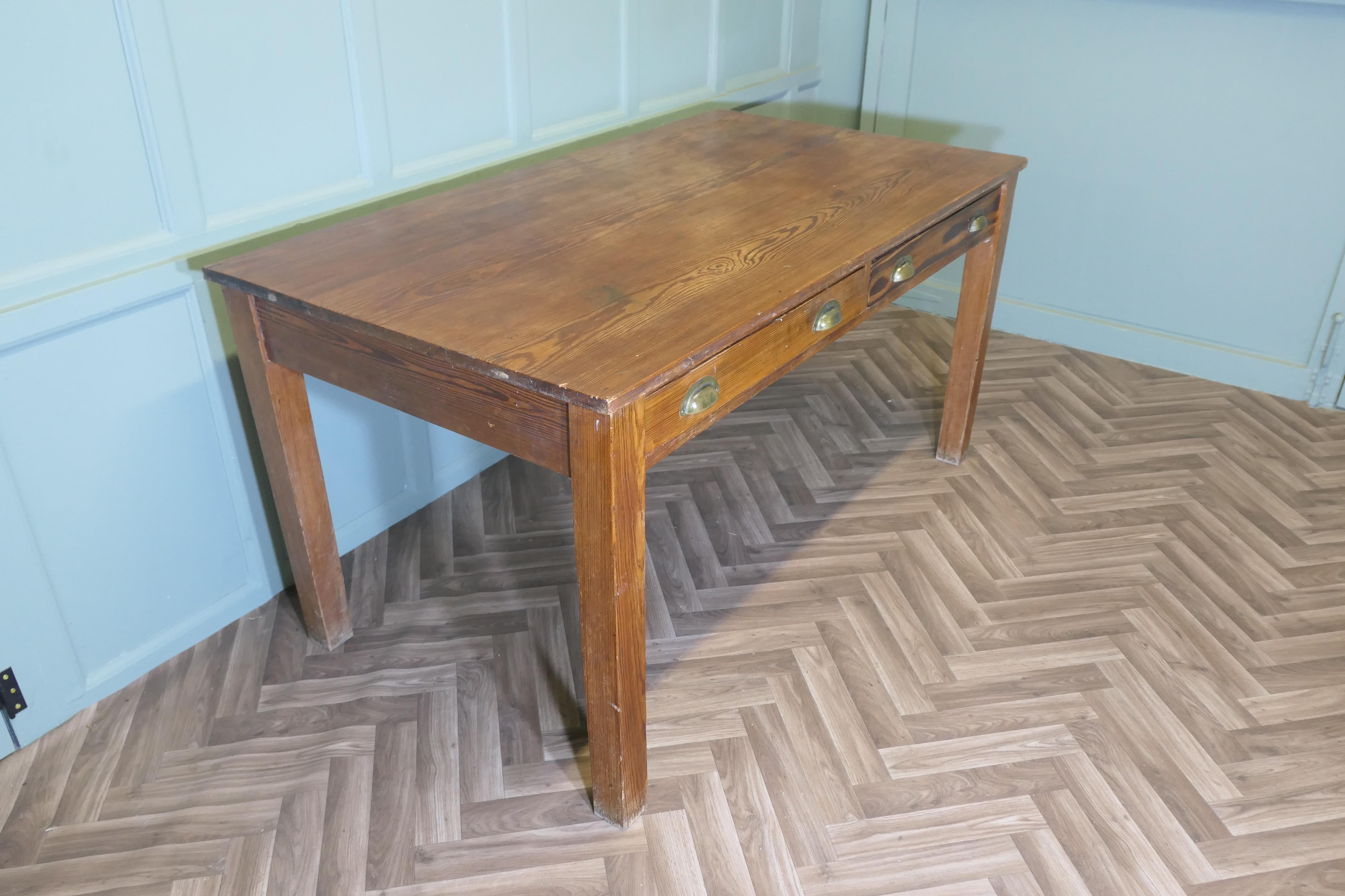 School Teacher’s Pine Writing Table  

This is a very good looking sturdy Pine table, the pine has a mellow age darkened colour with 2 drawers, a plank top, and square legs legs
The table is in very good condition, it is sound and does not wobble