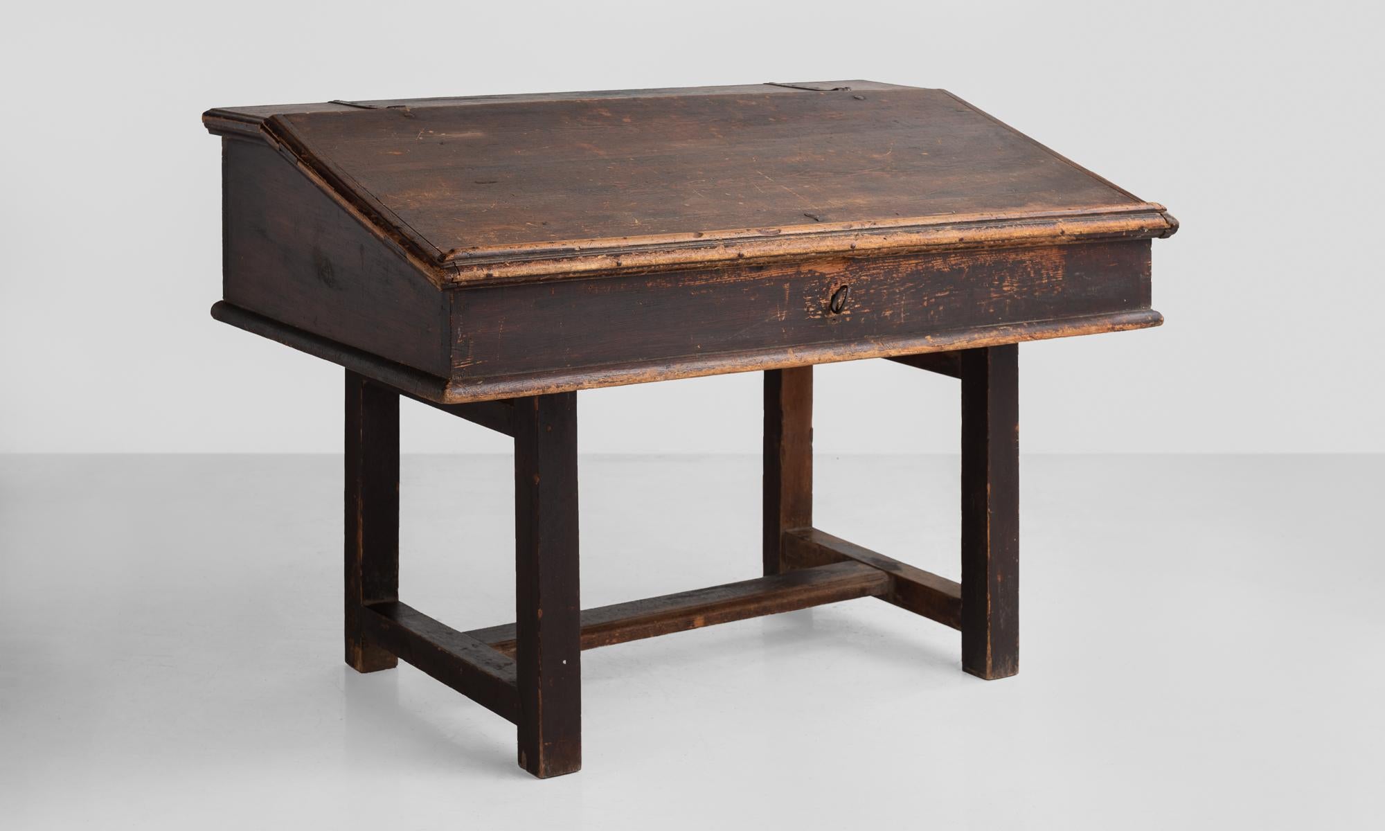 Schoolhouse desk, Sweden, circa 1900

Unique form with sloped top and storage within.

Slope height goes from 28.5