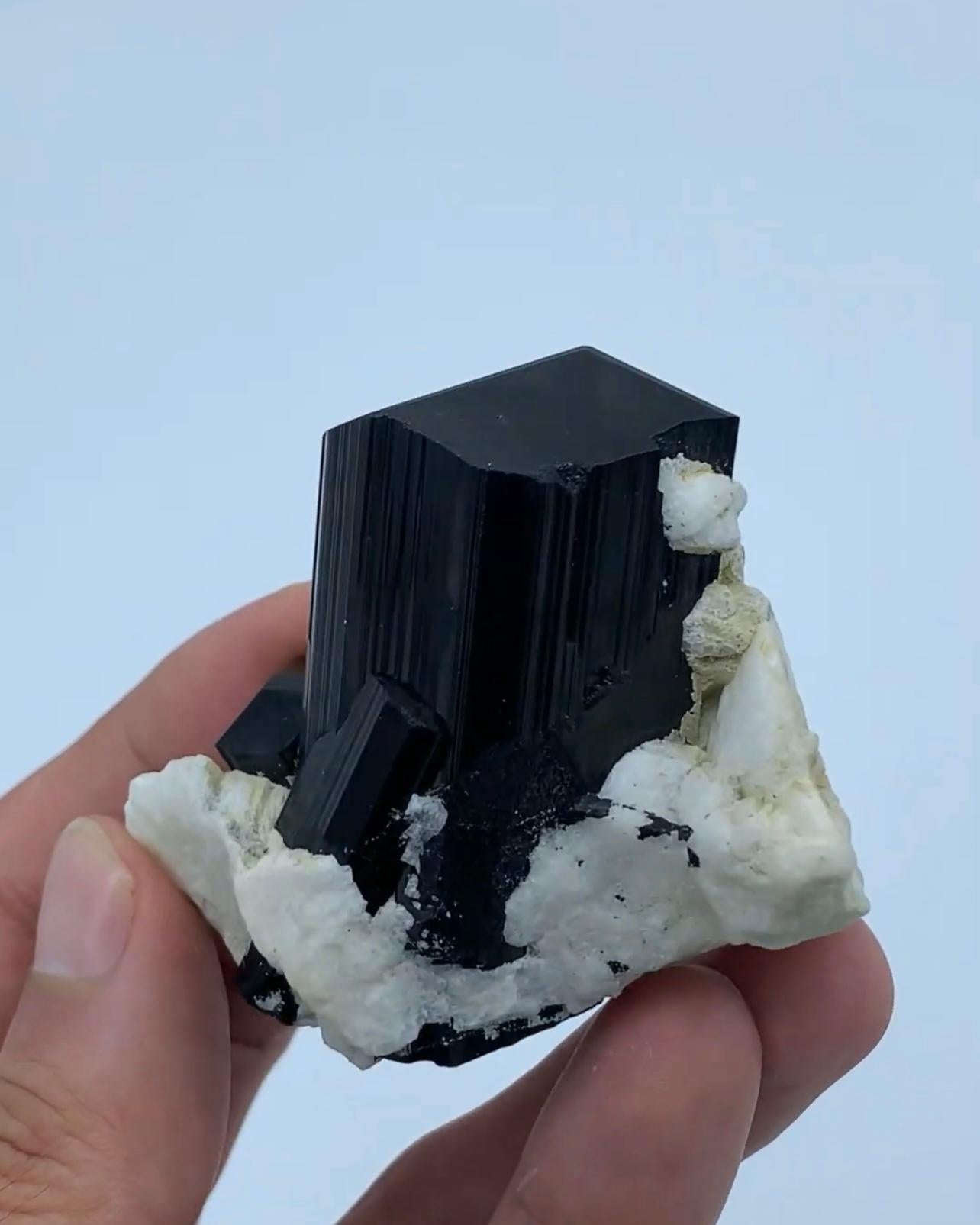 Product Information:

Specimen Name: Tourmaline crystals on Albite

Weight: 132 grams

Dimensions: H: 5.5 x W: 6 x D: 3 cm

Treatment: None

Origin: Kunnar Province, Afghanistan

Description:

This exquisite specimen features a lustrous Schorl Black