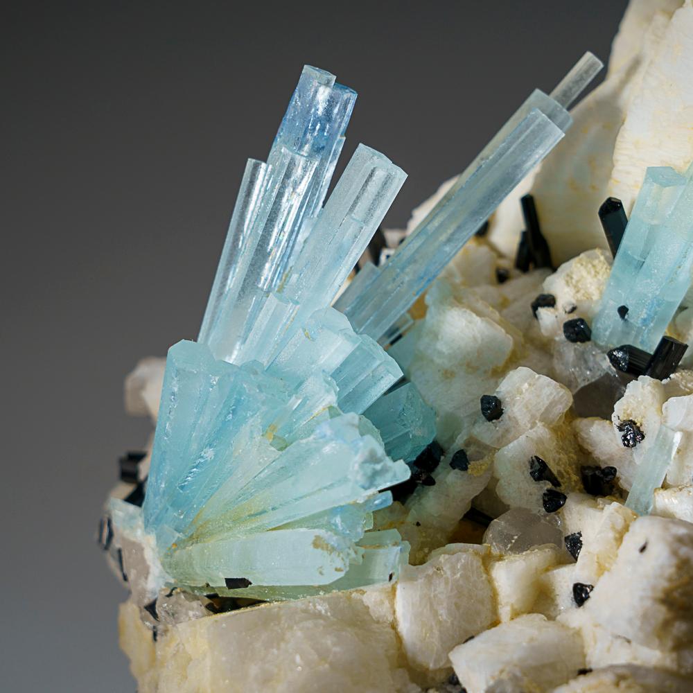 From Shigar Valley, Shigar District, Gilgit-Baltistan, Pakistan

Cluster of many elongated aquamarine crystals with lustrous black schorl tourmaline crystals and quartz crystals on albite matrix. The aquamarine crystal is flawless internally and has