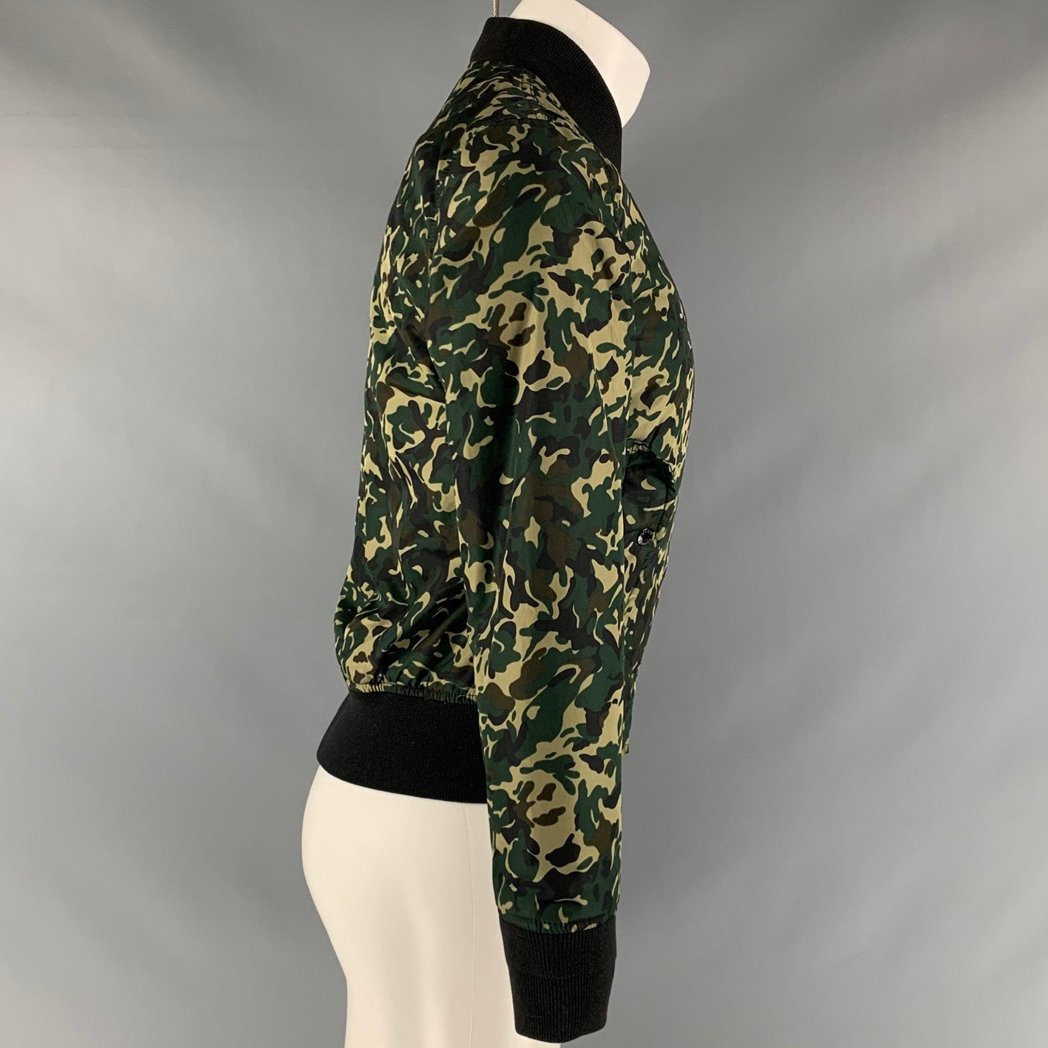 SCHOTT Jacket bombers W featuring a camouflage print, mandarin ribbed collar, flap pickets, and 
zipper up closure.Excellent Pre-Owned Condition.  

Marked:   M 

Measurements: 
  Chest: 40 inches Shoulder: 16 inches Length: 23.5 inches Sleeve: 25