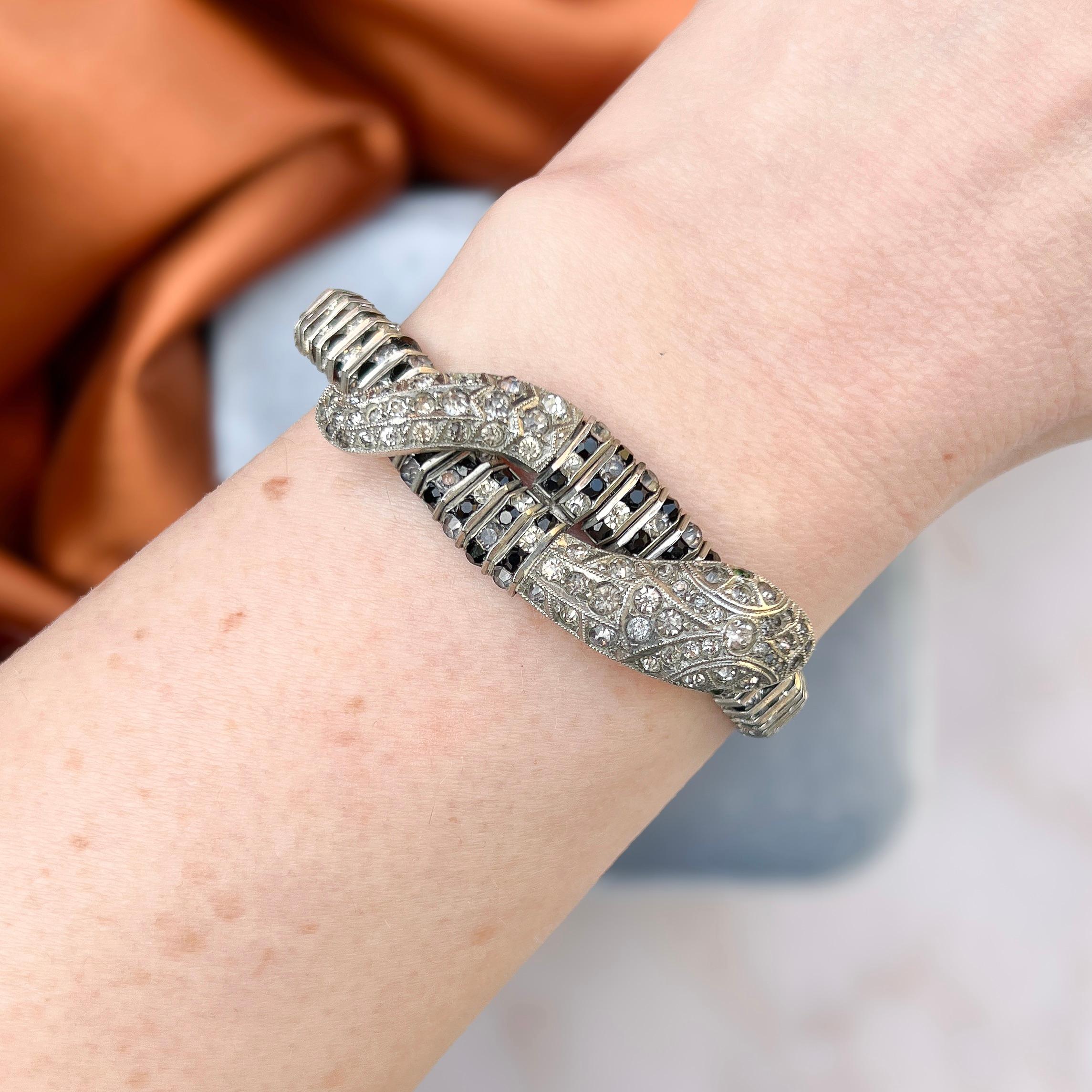This bracelet dates from the 1930s and is an exceptionally rare creation by the German Schrieber and Hiller.

Condition Report:
Very Good - A little element of darkening to some of the paste stones on the head and tail of the snake. This is