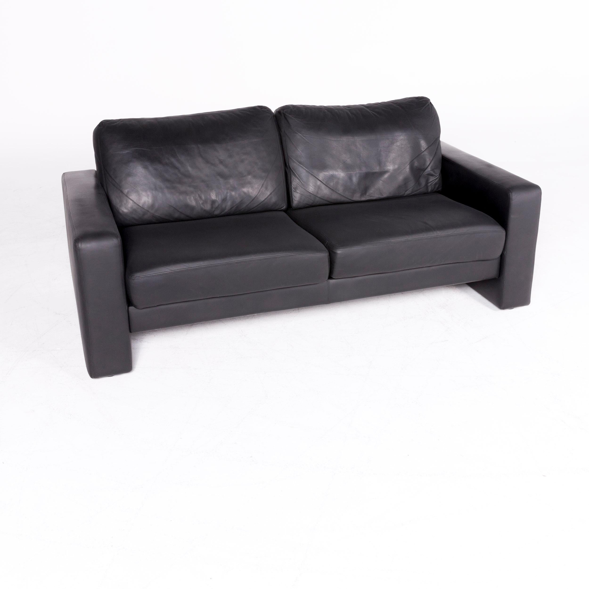 We bring to you a Schröno designer leather sofa black genuine leather two-seat couch.

Product measurements in centimeters:

Depth 89
Width 182
Height 77
Seat-height 43
Rest-height 55
Seat-depth 50
Seat-width 146
Back-height 35.
 