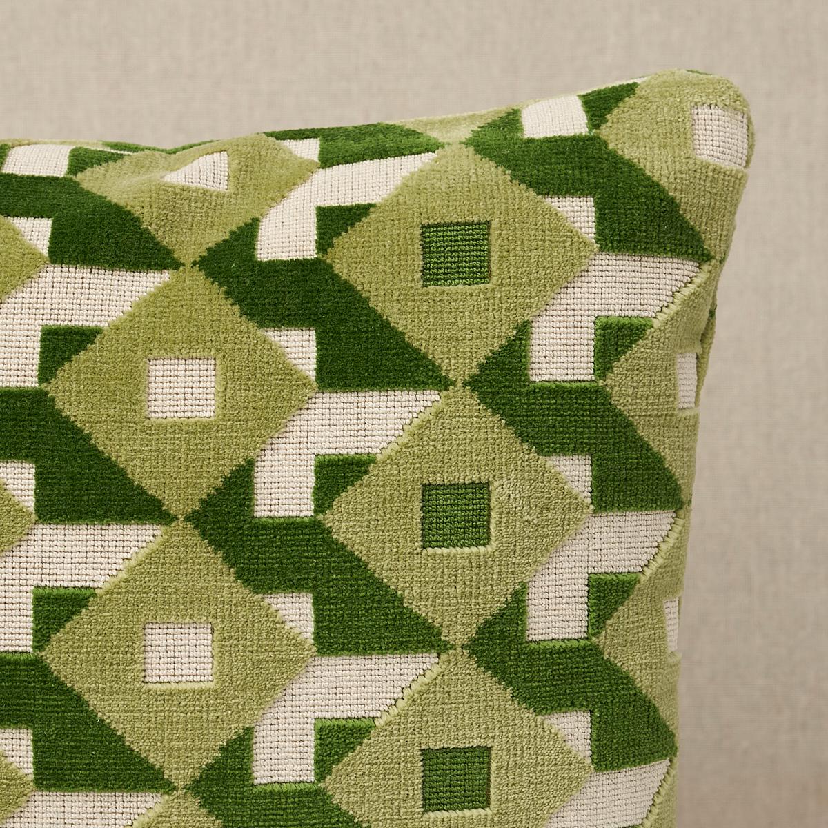 This pillow features Dazzle Ship Velvet by Johnson Hartig for Schumacher with a knife edge finish. An all-over three-color geometric in verdant reminiscent of Op Art patterns is rendered in cushy cut velvet to create a supremely sophisticated