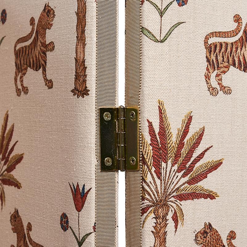 The perfect accent to any room – this decorative screen features Tiger Palm fabric from Schumacher’s Mystique Collection. Inspired by antique block prints, this versatile, mid-scale fabric design features stylized palm trees, rampant tigers, and