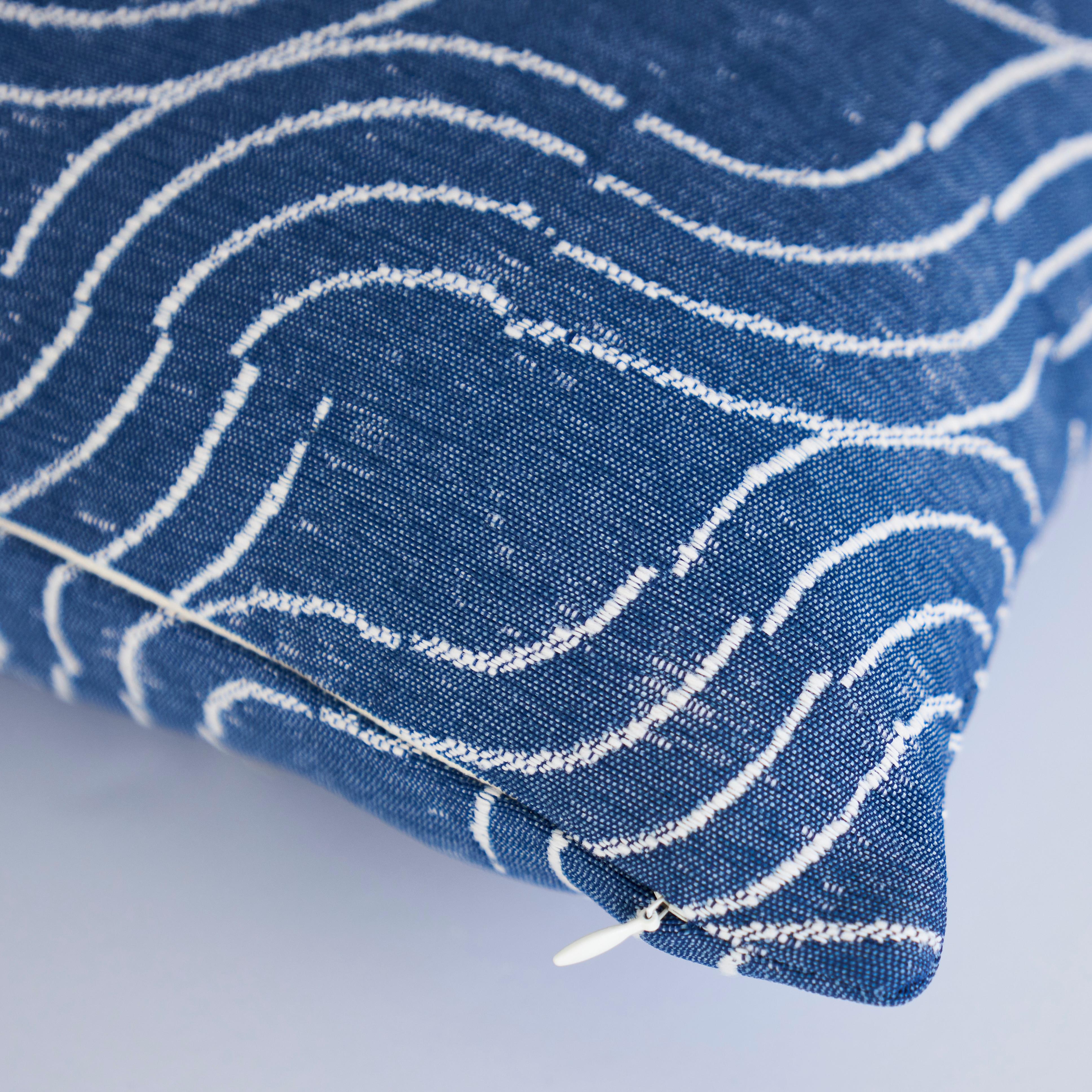 This pillow features Alma Indoor/Outdoor with a knife edge finish. Based on a woodblock our design director carved by hand, this interlocking pattern reinterprets a block-print into a winning, rugged high-performance woven with an artisanal feel.