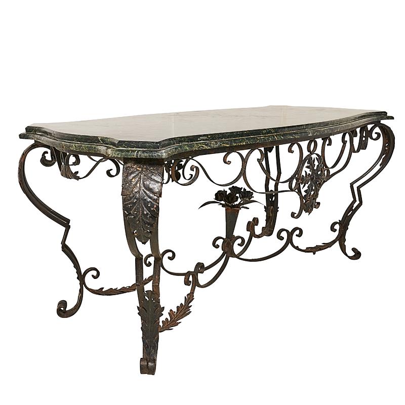 This French iron & marble table from the 19th century features a handsome green marble top, and a beautifully decorated wrought iron base complete with intricate flower detailing.  

Since Schumacher was founded in 1889, our family-owned company has