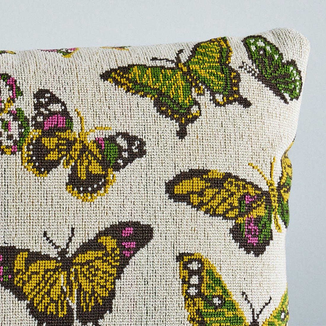 This pillow features Butterfly Epingle with a knife edge finish. A ’70s-fabulous handstitched pillow inspired this hardwearing épinglé, which has the look of a needlepoint and a groovy flower-power color palette. Pillow includes a feather/down fill